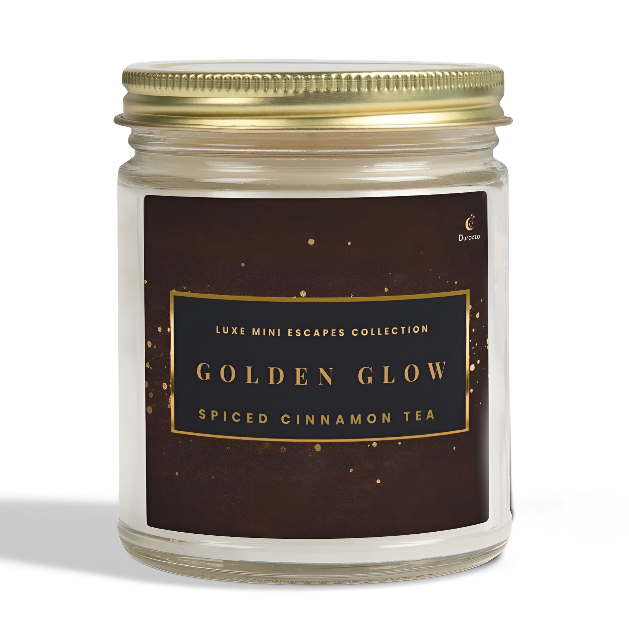 Candle jar labeled 'Golden Glow Spiced Cinnamon Tea' from the Luxe Mini Escapes Collection in an Autumn spiced cinnamon tea scent. 