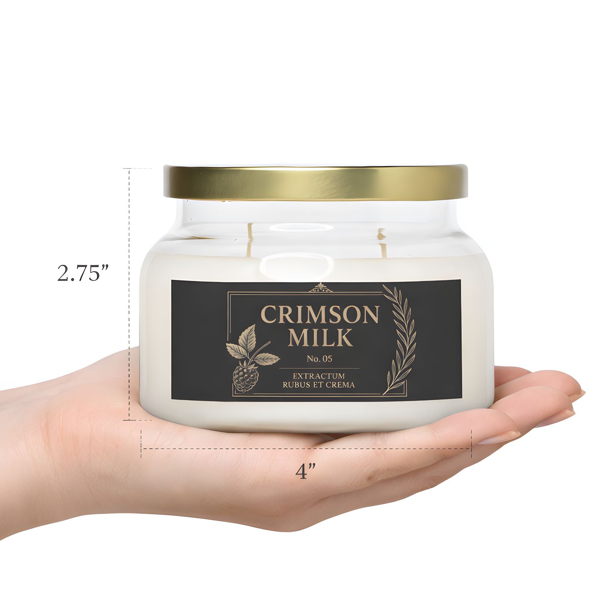 A person's hand holding the crimson milk candle in a blackberry cream scent showing its actual size.