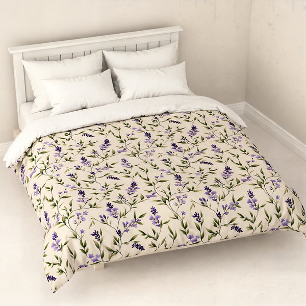 Lavender floral patterned duvet cover on a bed in a room with white walls and floor.