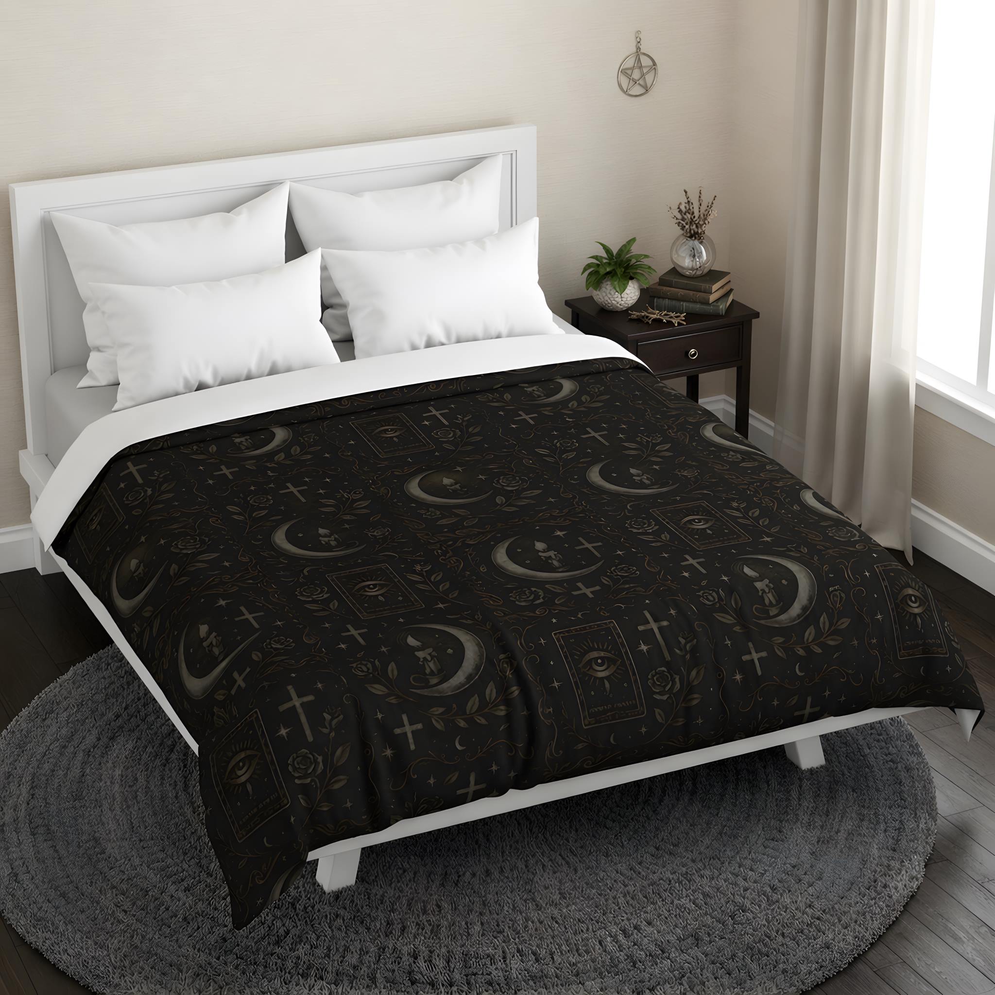 Black whimsigoth duvet cover on a bed with crescent moon and cross symbols.