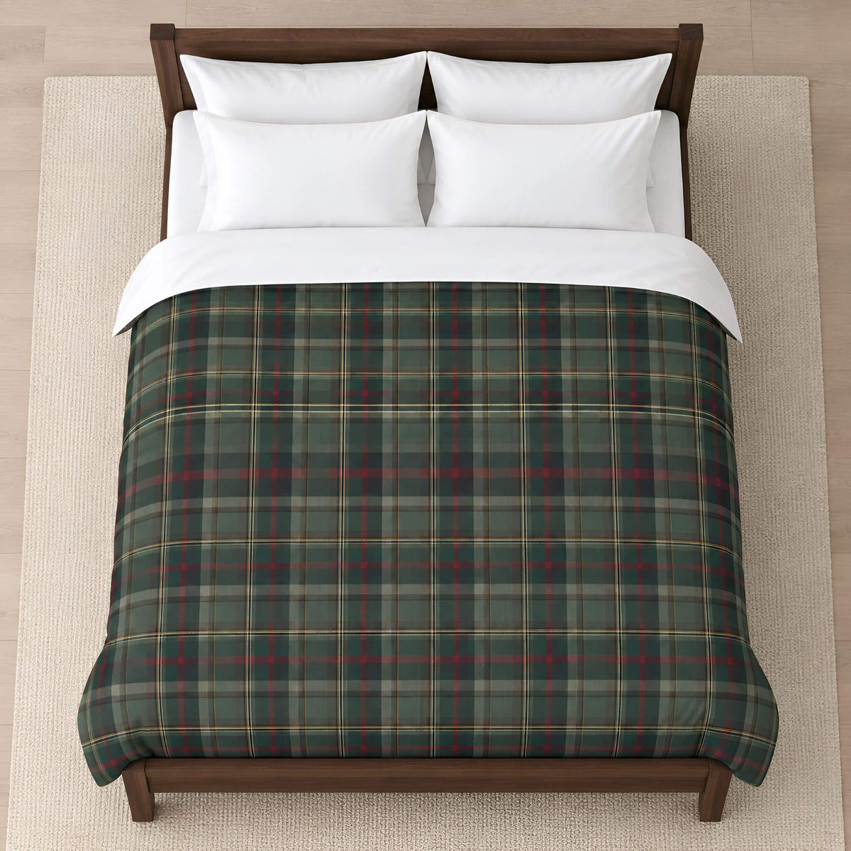 Overhead view of the Cedar Ember green plaid duvet cover spread across a bed with white sheets and pillows.