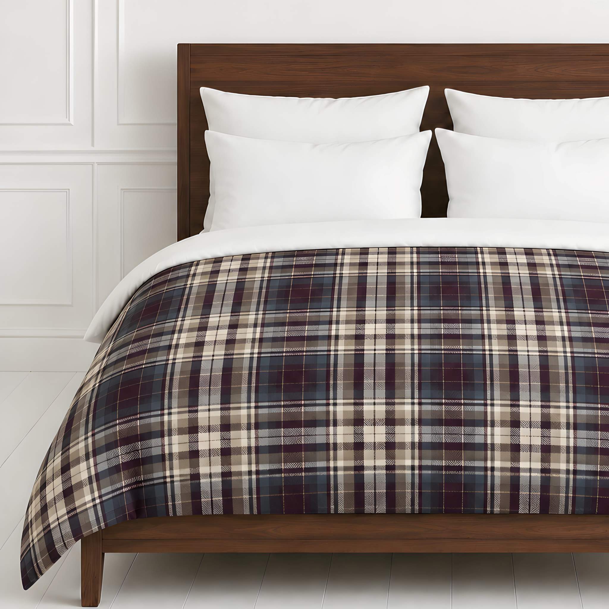 A plaid duvet cover in dark navy, plum, beige, and white tones, styled on a wooden bed frame with white pillows against a white paneled wall.