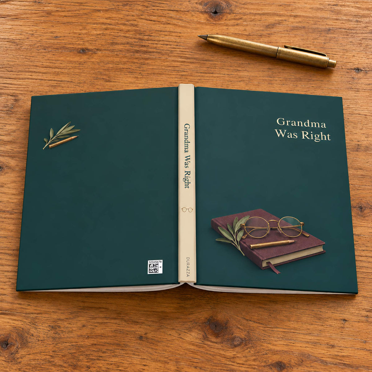 An open hardcover notebook titled 'Grandma Was Right' lies on a wooden tabletop, with a gold pen above it and the book cover showing olive-green artwork and the phrase 'Grandma Was Right.'.