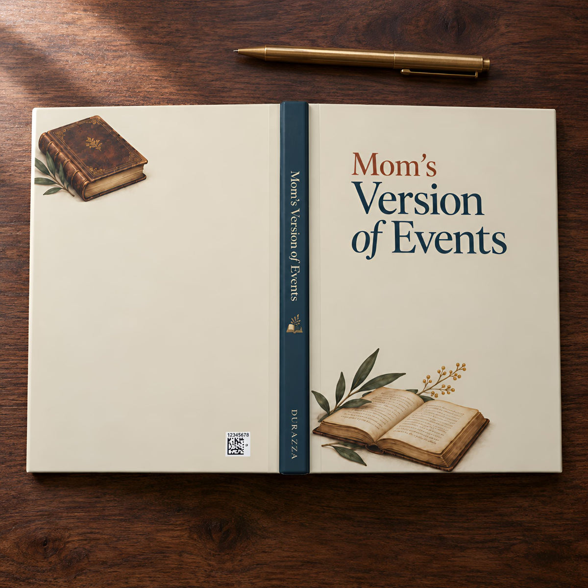 A hardcover writing journal titled "Mom's Version of Events" lies open on a dark wooden tabletop, with a gold pen placed above it. The cover is cream-colored with navy and rust text, illustrated with an old book and an open book with leaves and small flowers.