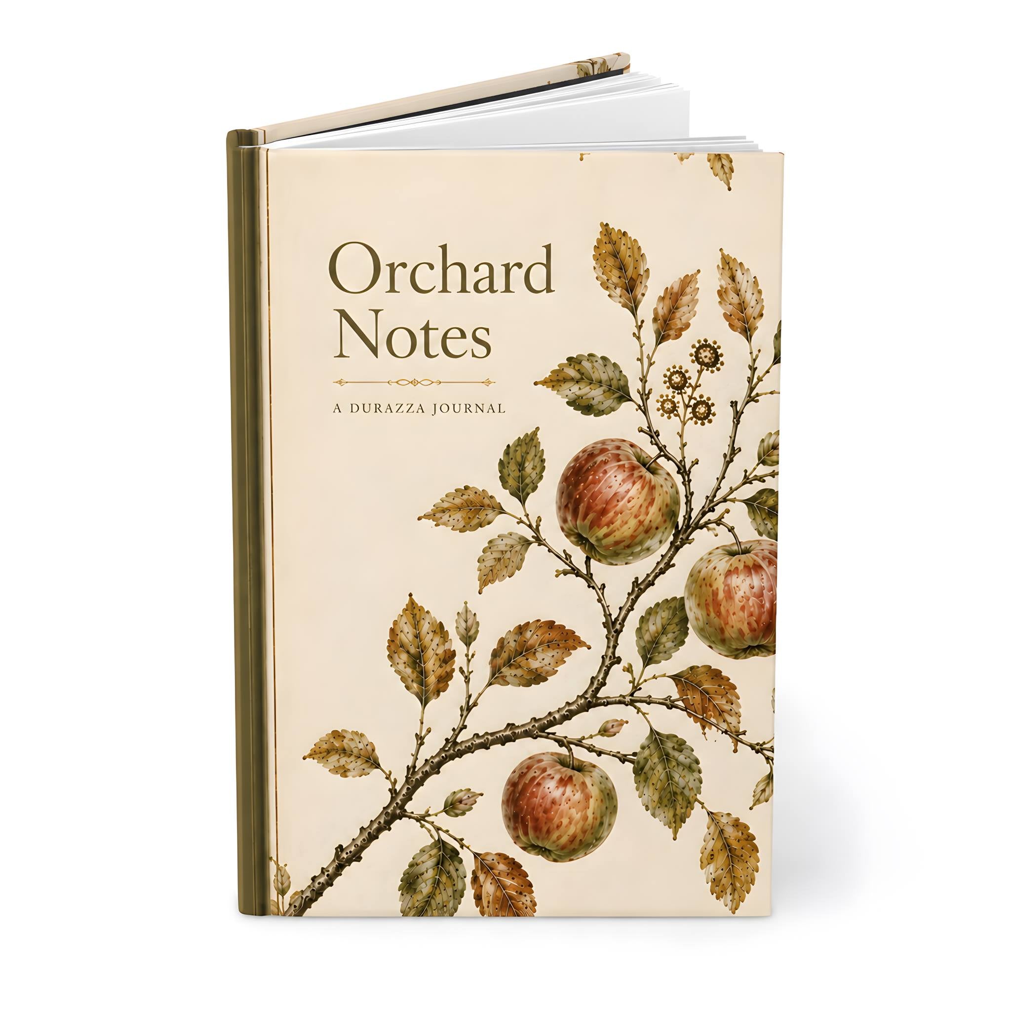 A hardcover journal titled 'Orchard Notes' , featuring a vintage-style botanical illustration of red apples and green-brown leaves on a warm cream cover, shown on a white background.