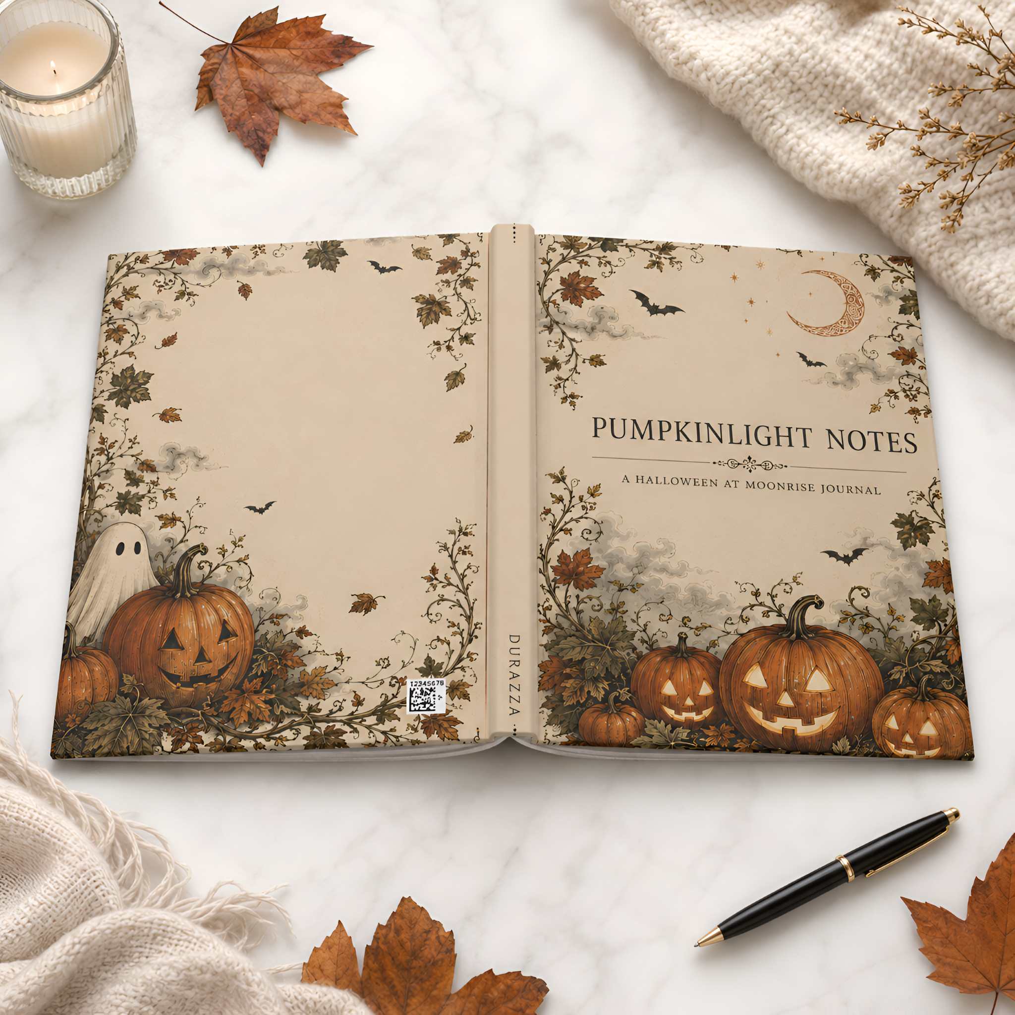 An open hardcover journal titled 'Pumpkinlight Notes' lies on a table with seasonal props including a candle, and leaves. The cover features a fall Halloween harvest illustration with pumpkins, bats, a ghost, and a crescent moon.