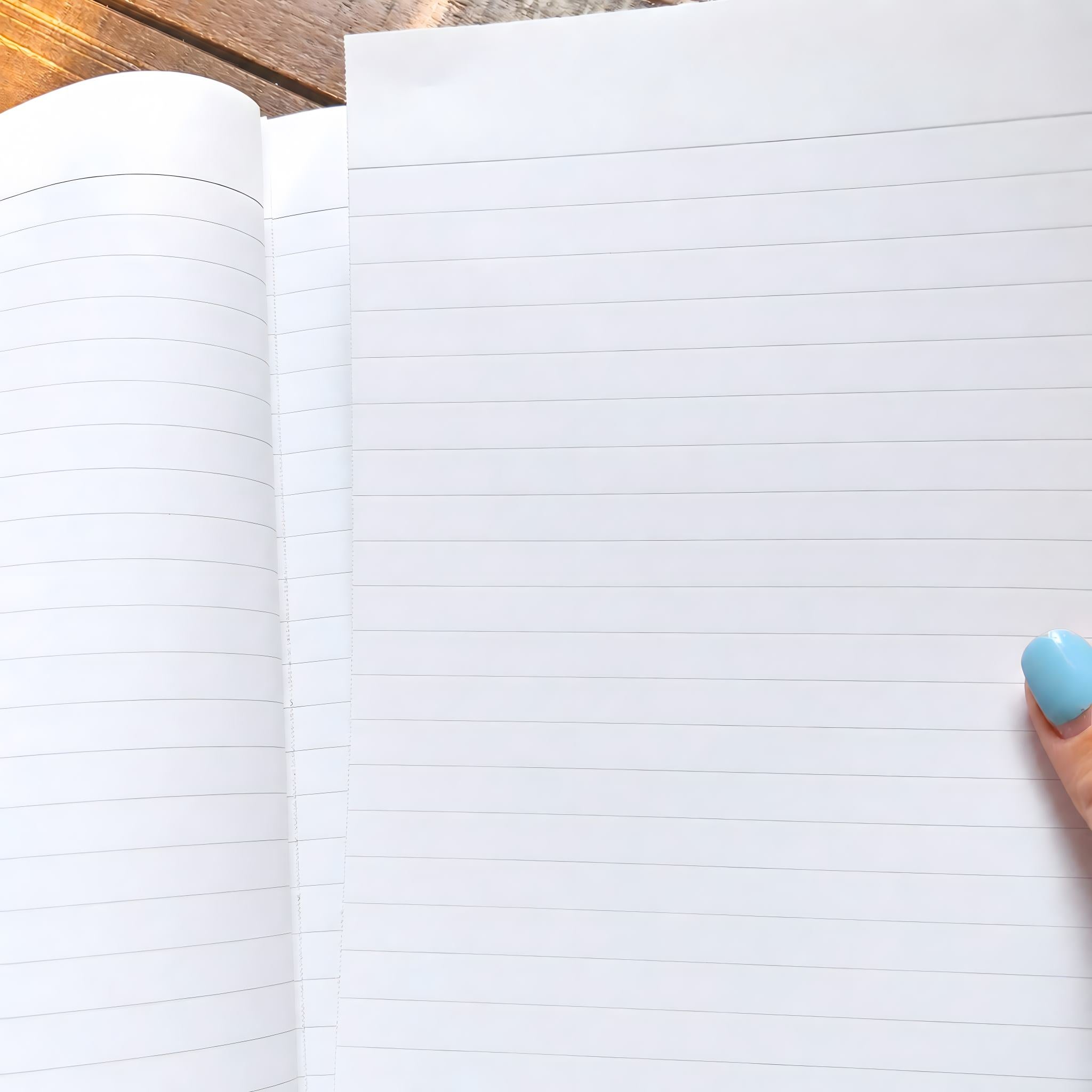 Lined hardcover notebook with perforated pages, showing page being torn out.
