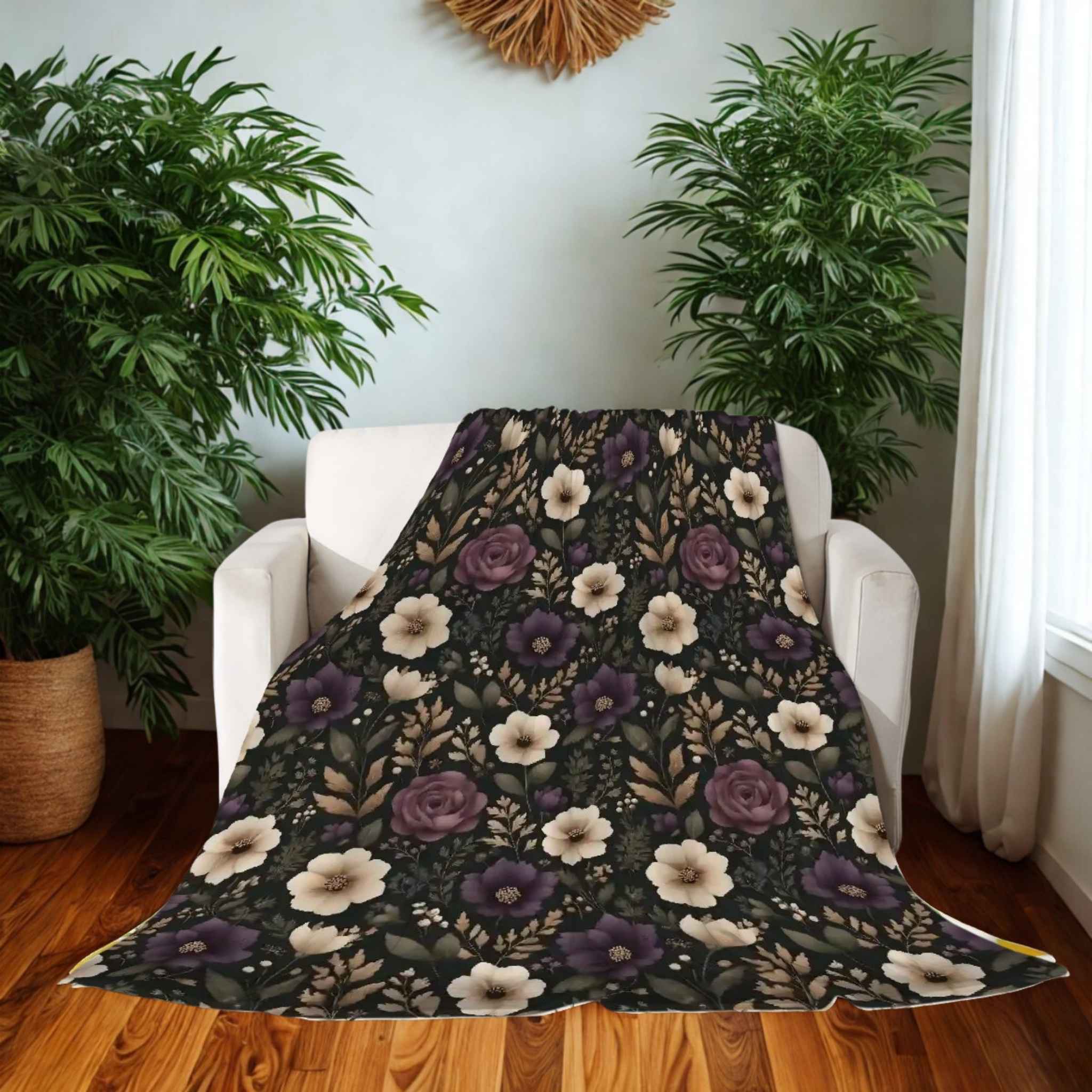 Floral patterned blanket draped over a white chair in a room with plants and a window.