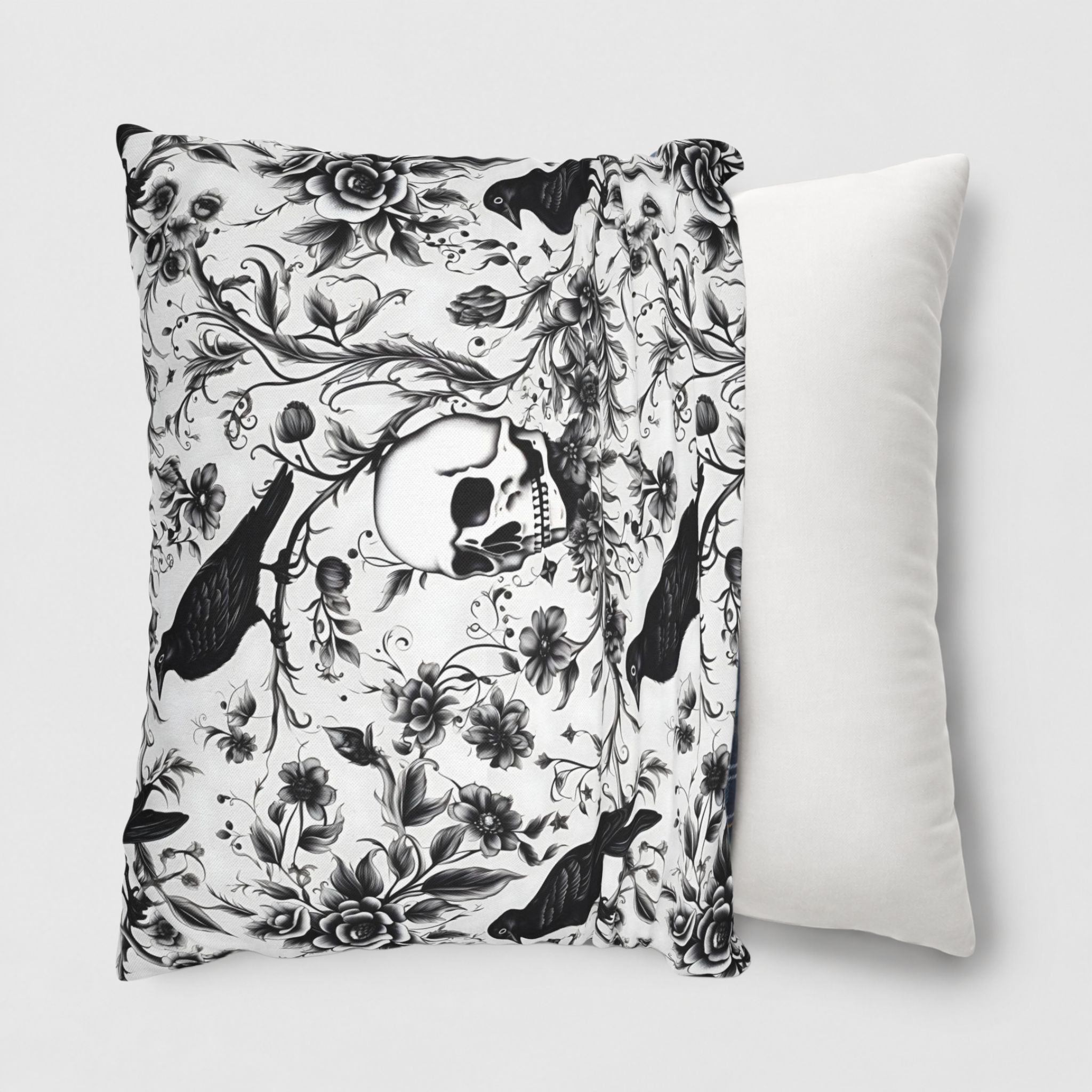 Victorian Gothic pillow cover with black ravens, skull, and flowers, being slid onto a 18 or 20 inch throw pillow.