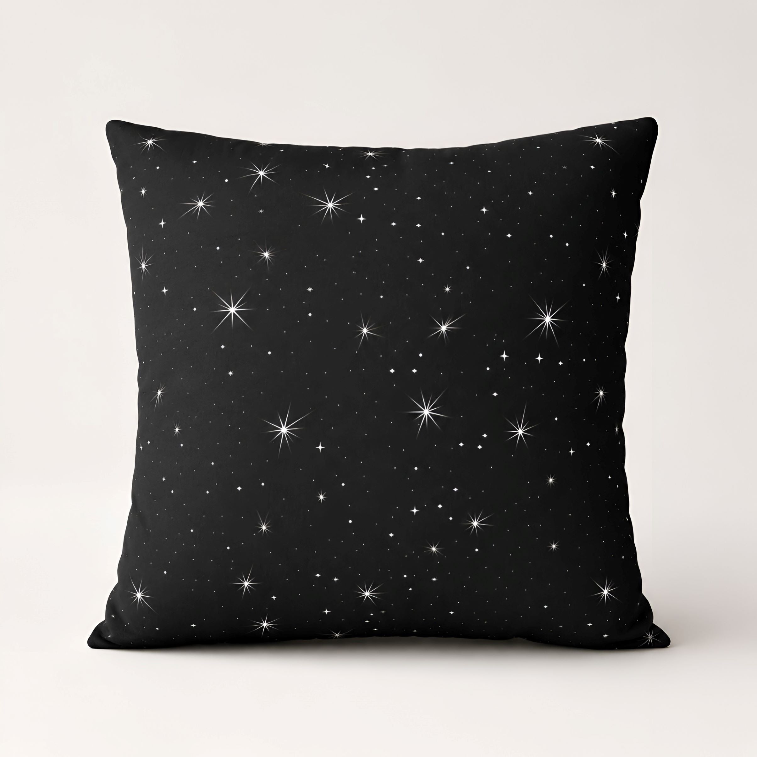Black faux suede pillow cover with white stars for great celestial detail.
