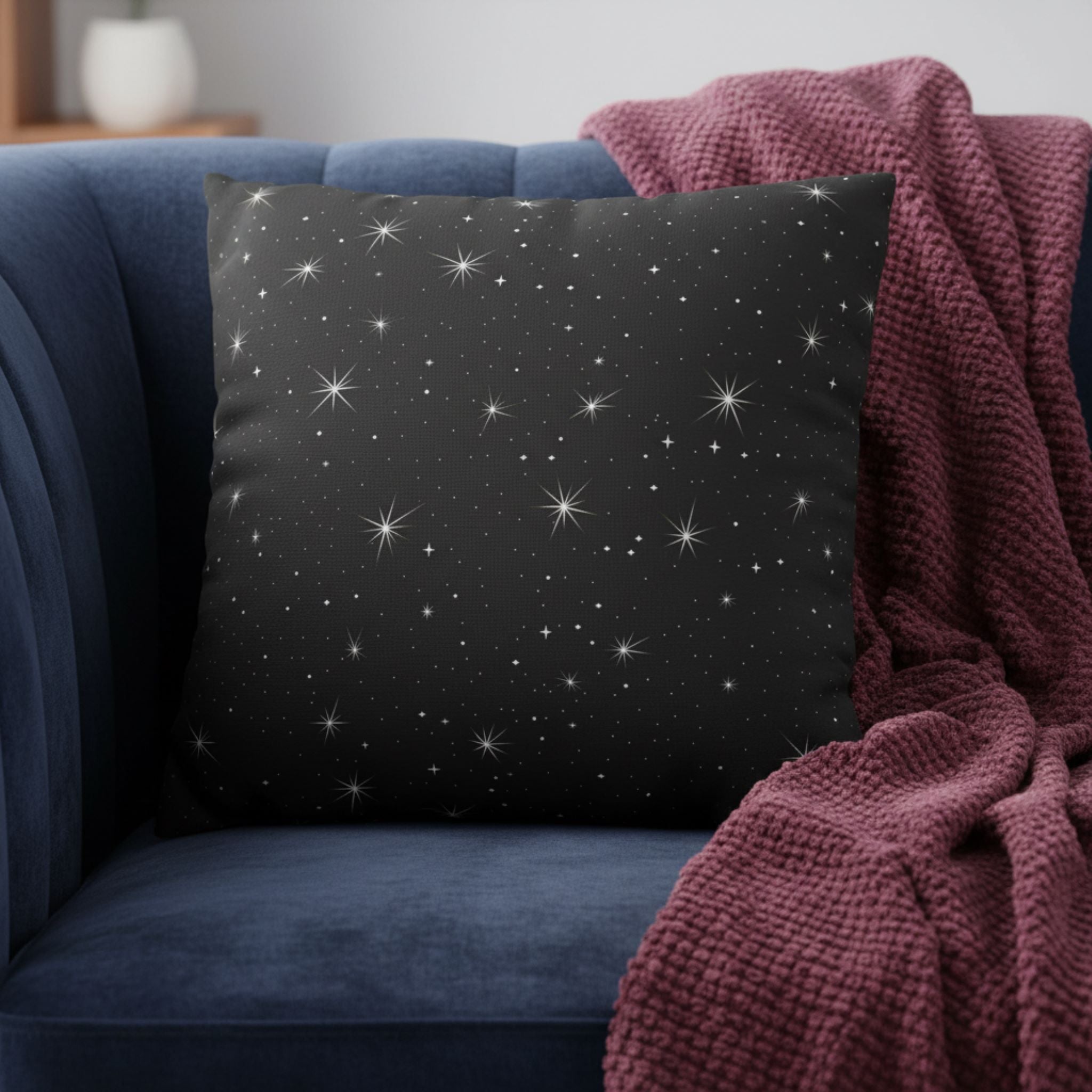 Starry night pillow cover on a blue couch with red throw blanket for a whimsigoth home styling.