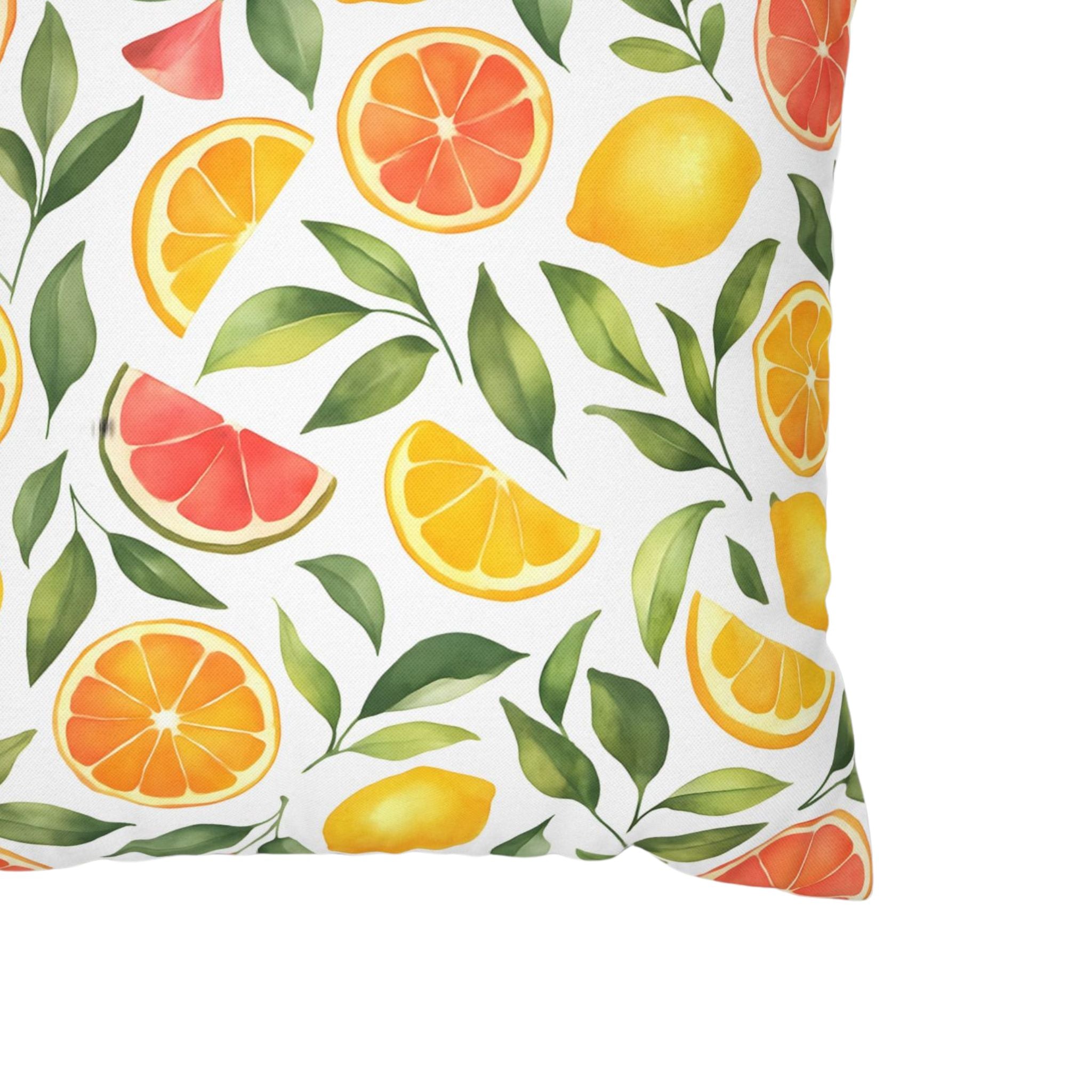A closeup of an 18 inch pillow cover showing a lemon, orange and pink grapefruit pattern.