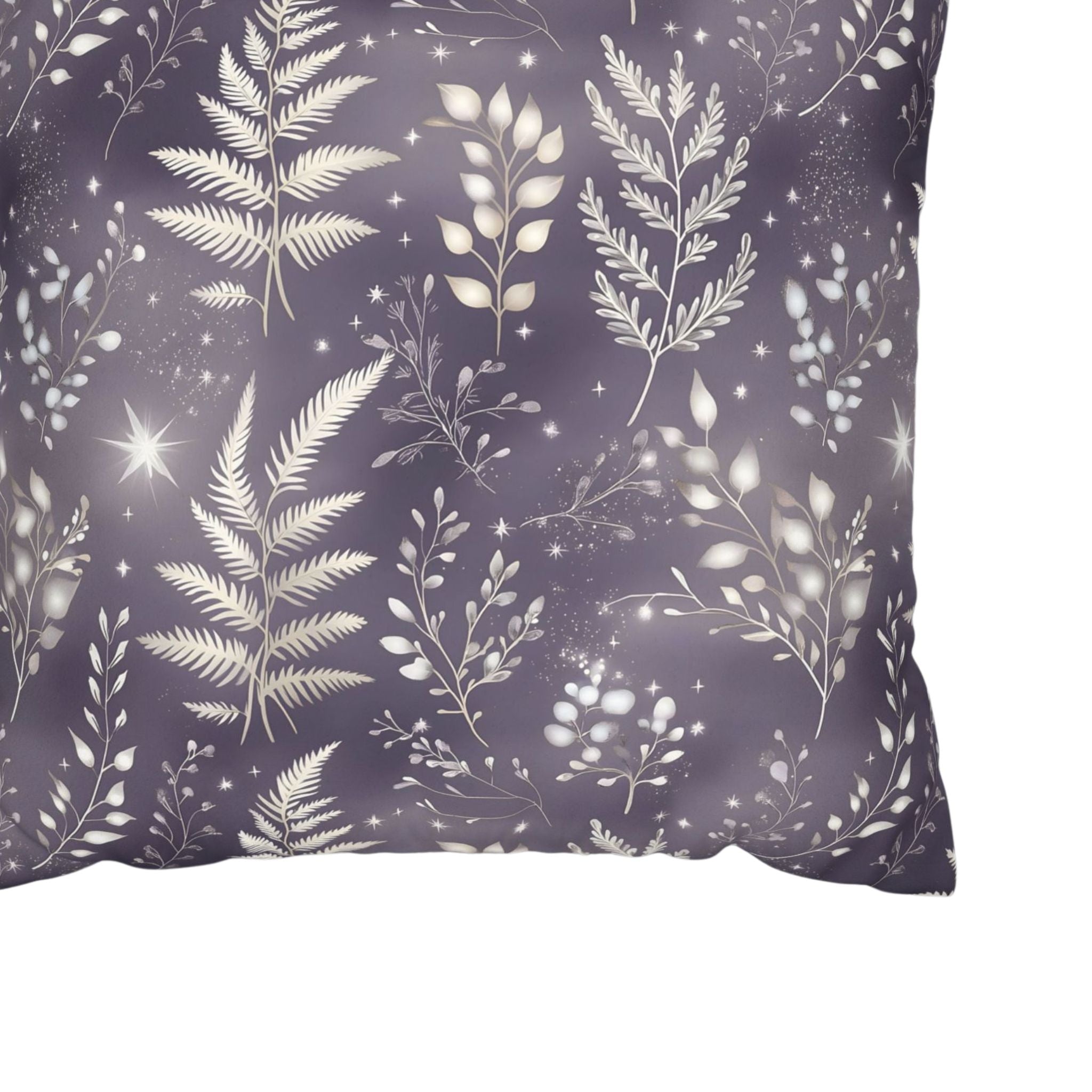 A throw pillow cover close up looking at the purple and white fern leaf design.