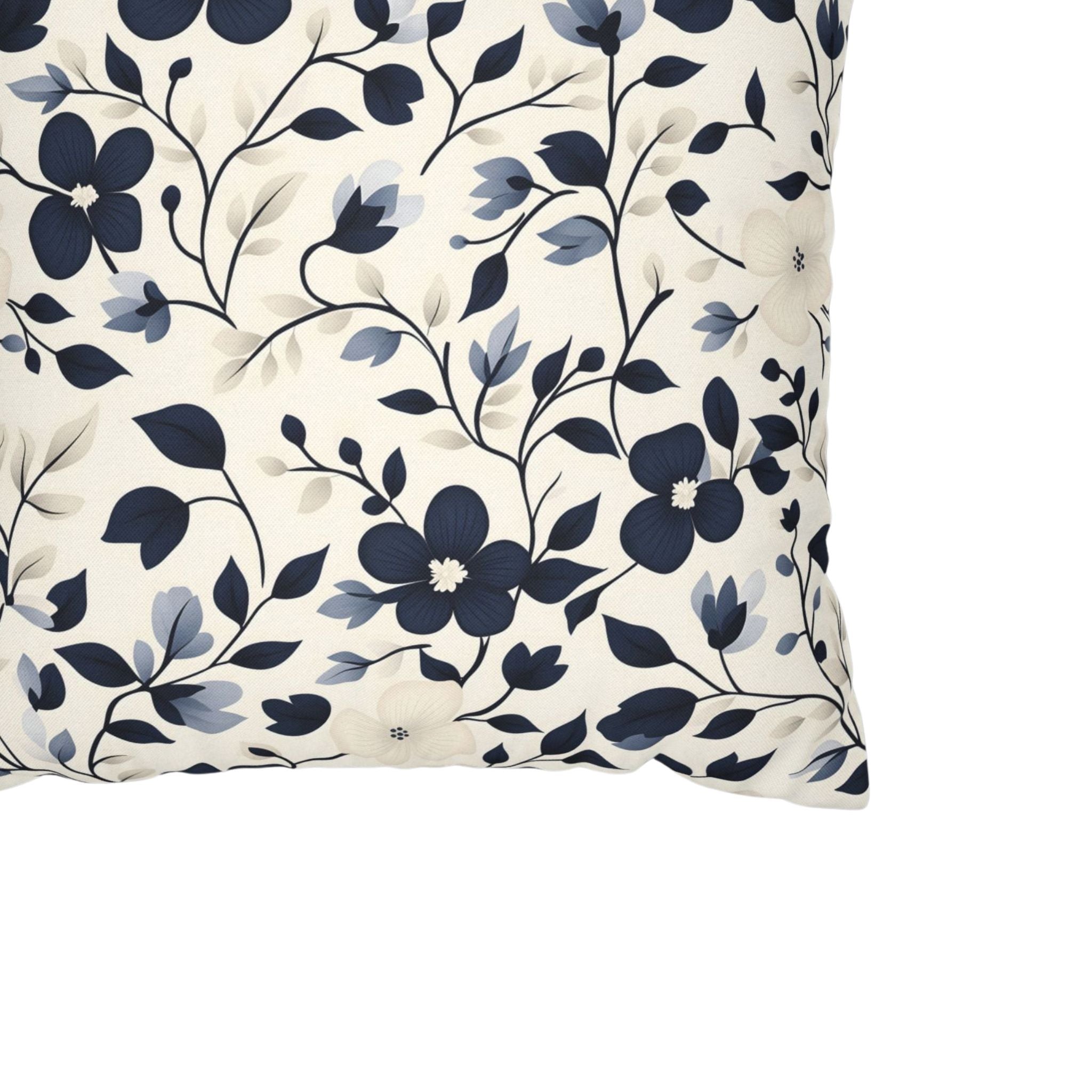 Close-up of navy and cream floral pillow cover pattern with blue vines