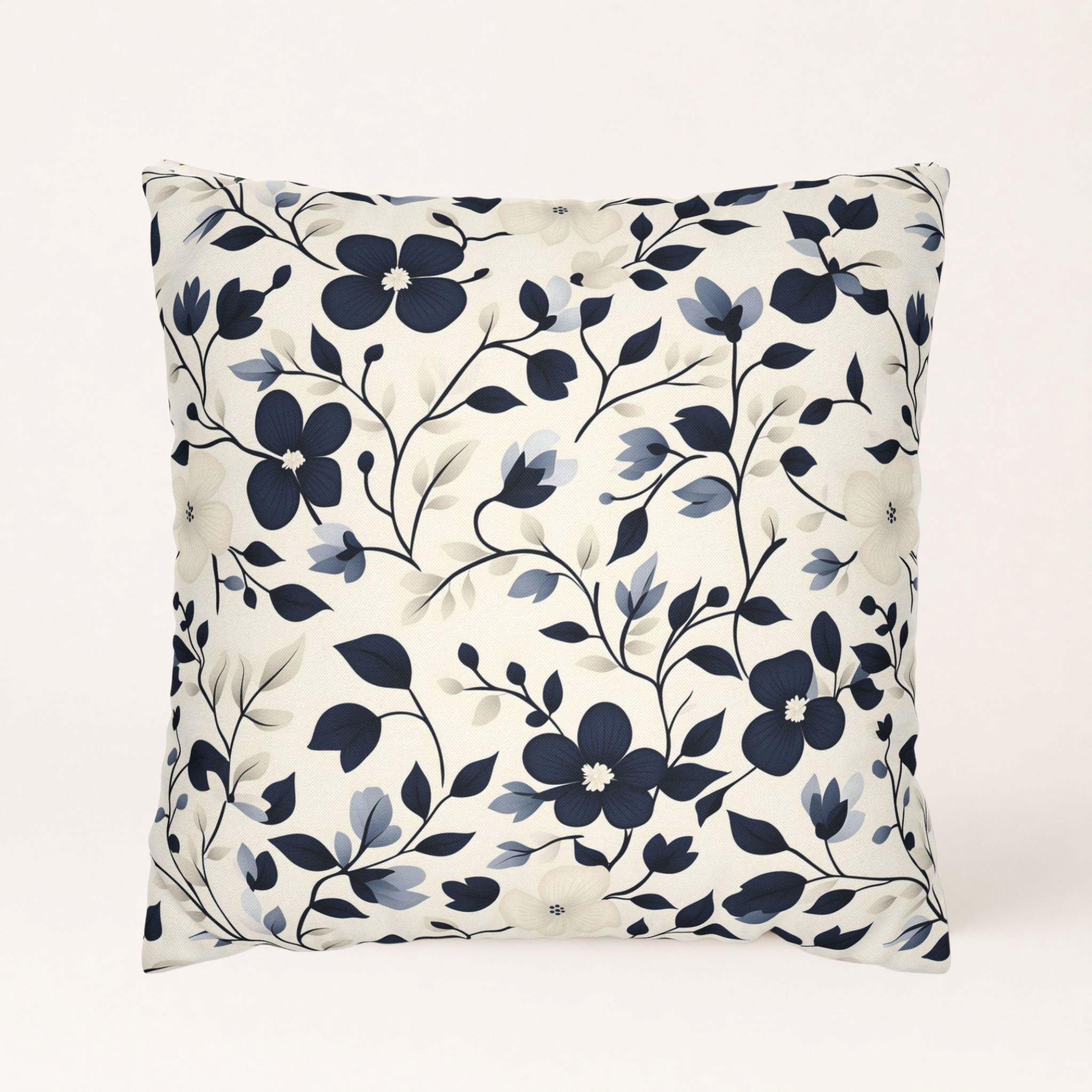 Navy floral pillow cover with cream blossoms and winding vines on white background.