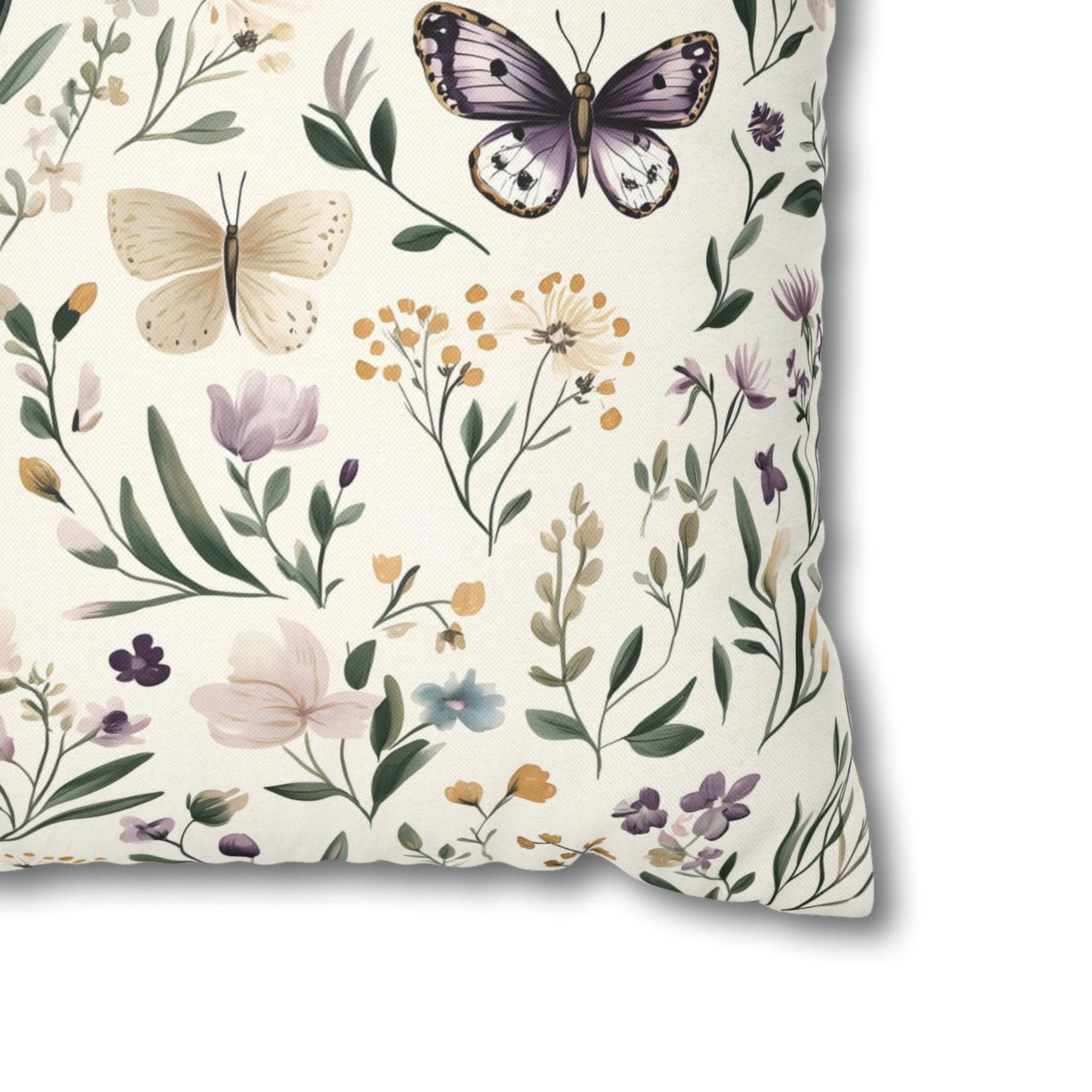 Closeup of polyester pillow cover showing purple butterfly and wildflowers.