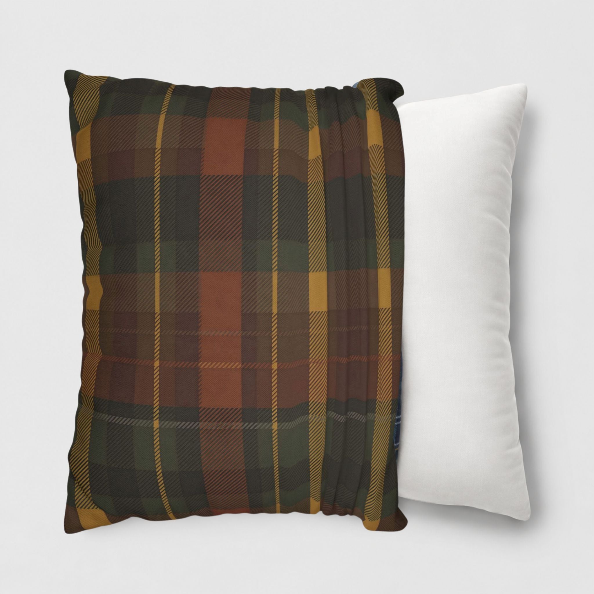 Tartan pillowcover and a plain white pillow on a light gray background