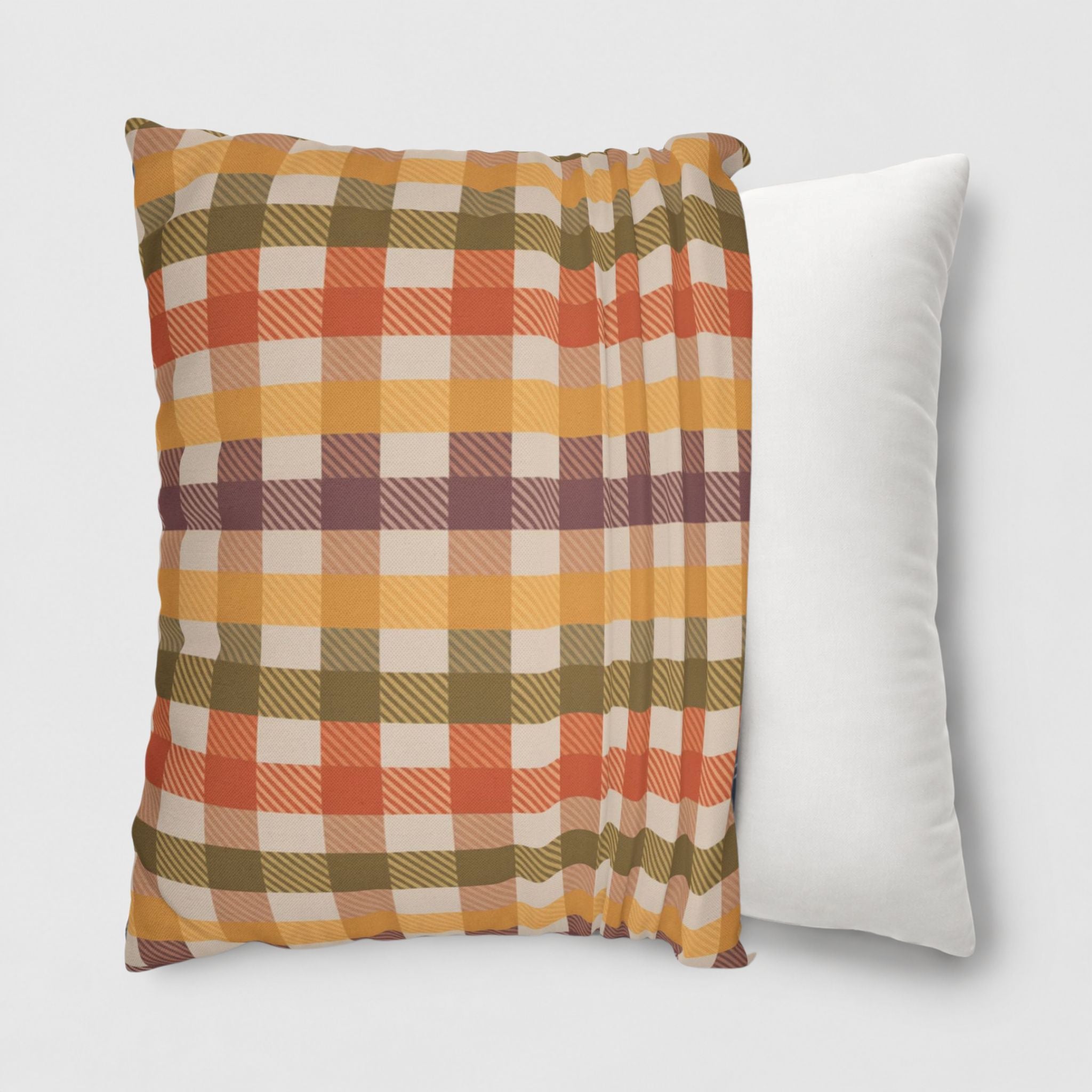 Autumn plaid pillow being put onto an 18" throw pillow.