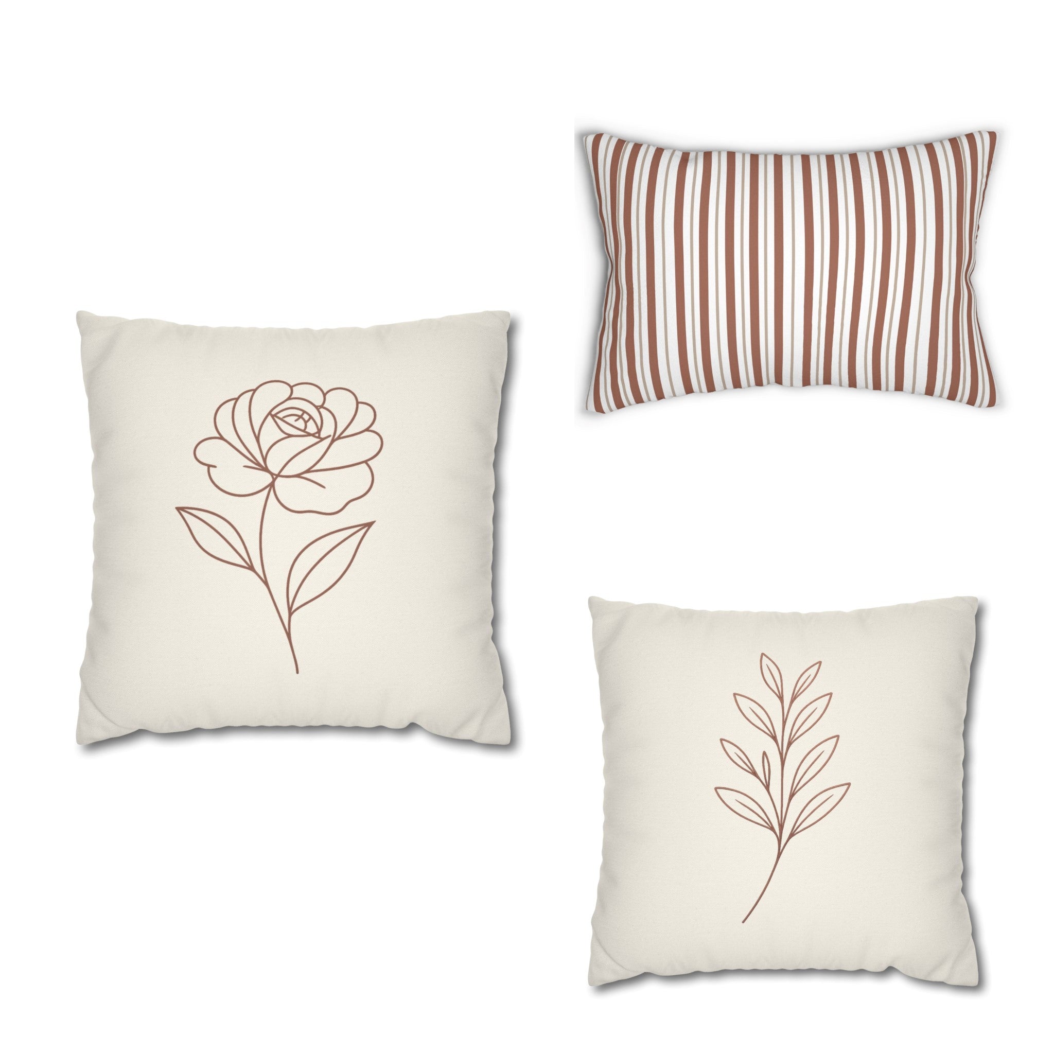 Three decorative pillows with floral designs on a white background