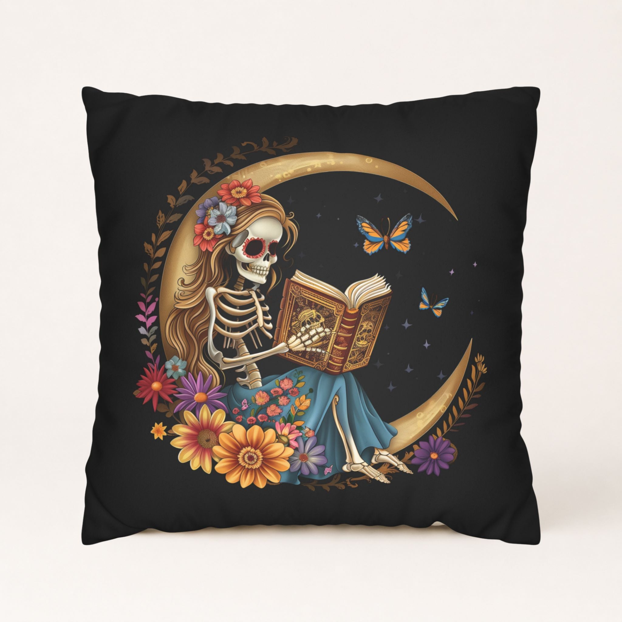 Skeleton moon pillow cover with book, flowers, butterflies, and gold crescent on black