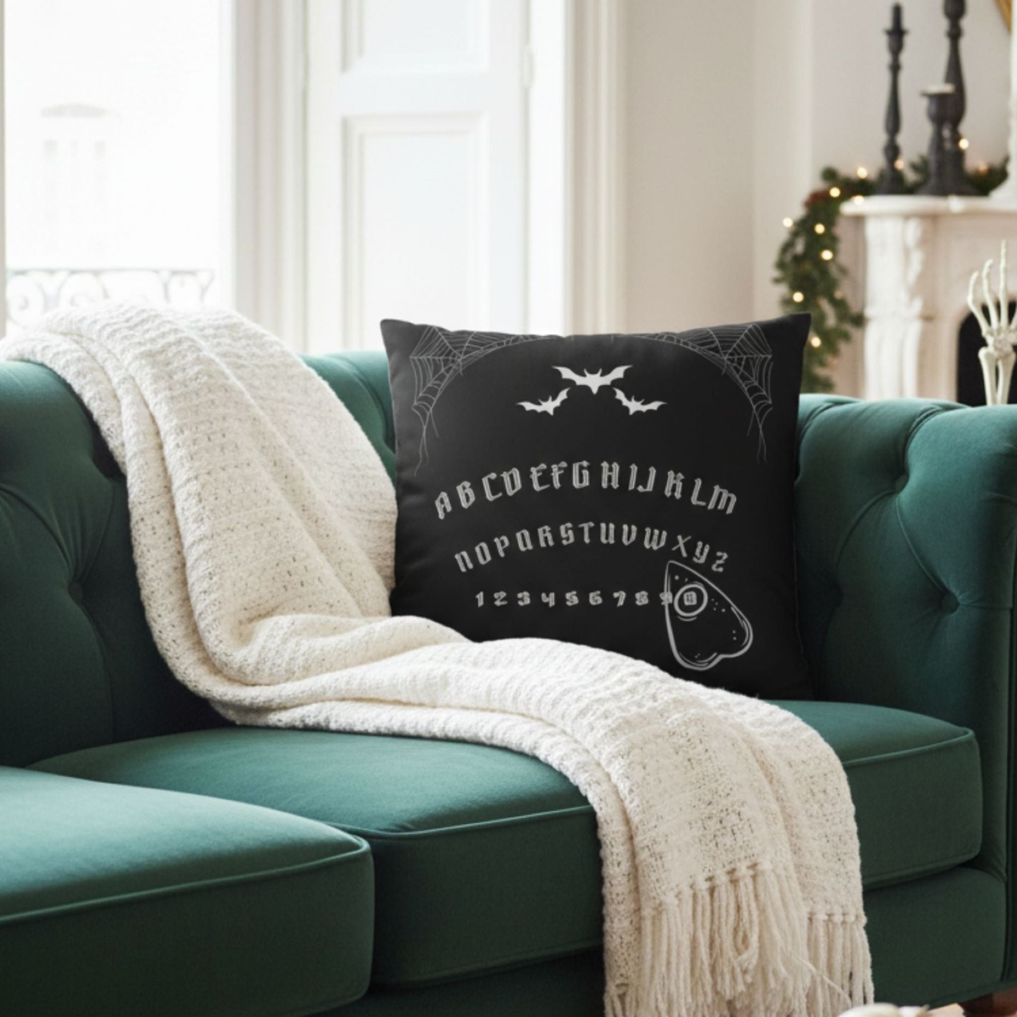 Gothic Halloween pillow cover styled with green sofa, neutral throw, and candle decor.