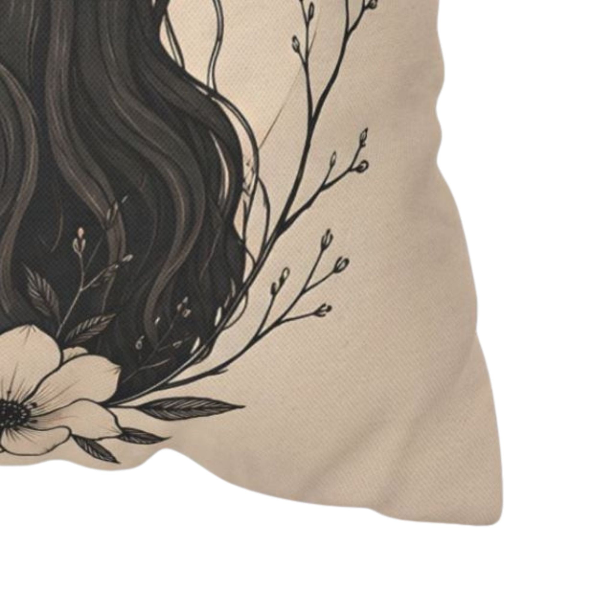 Zoomed in beige pillow cover with black floral and branch design on a white background