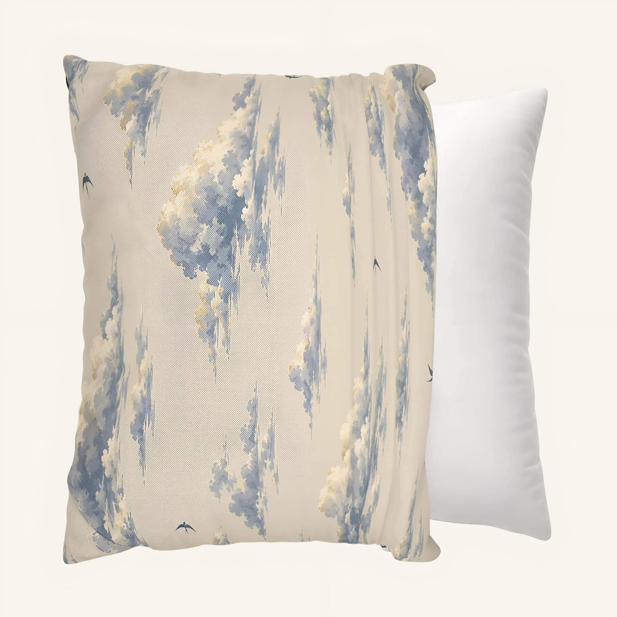 Angled views of the Cloudveil throw pillow cover showing the blue cloud print front being put onto a pillow insert.