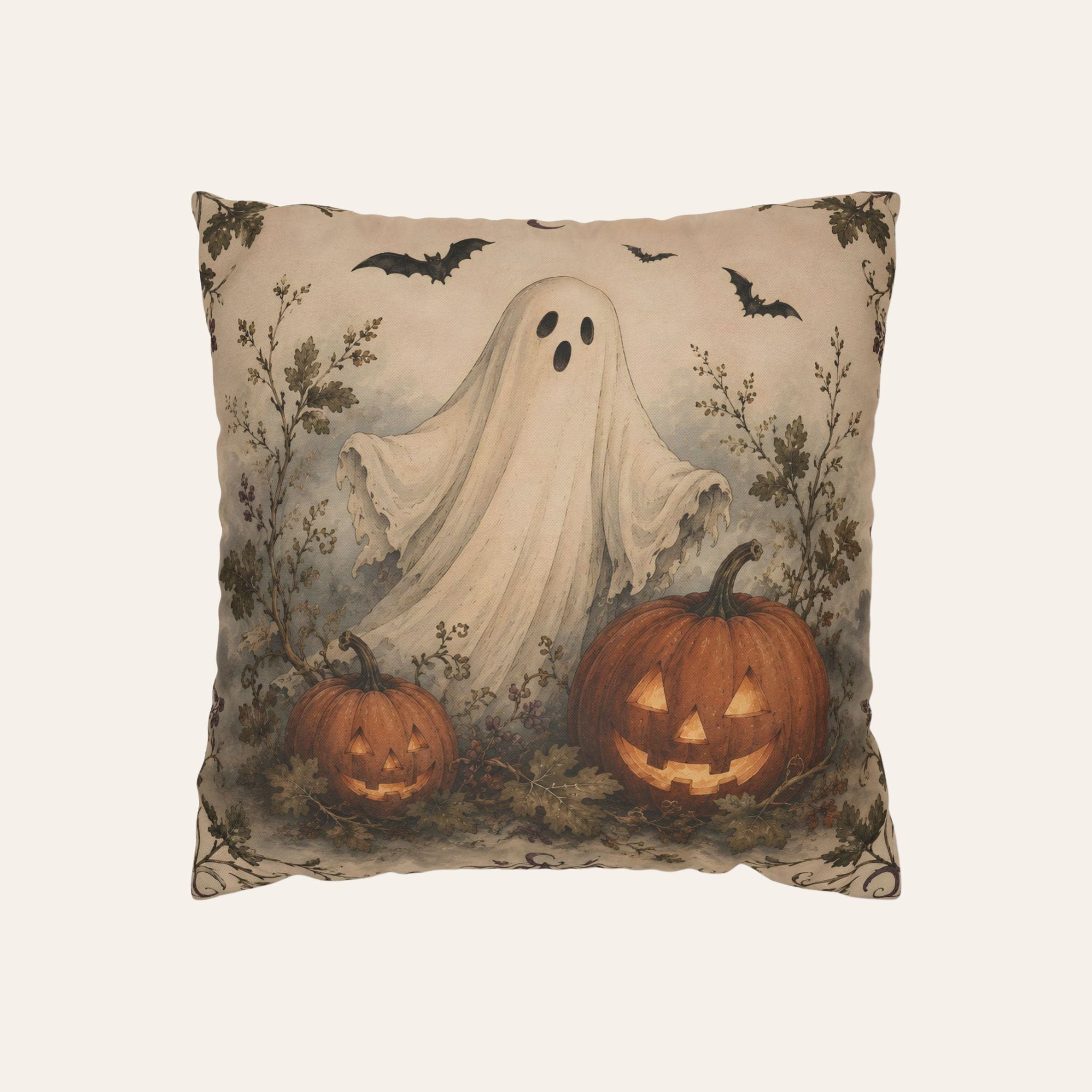 A square beige throw pillow featuring a vintage-style Halloween illustration with a ghost, two jack-o'-lantern pumpkins, bats, and dark foliage on a warm beige background.