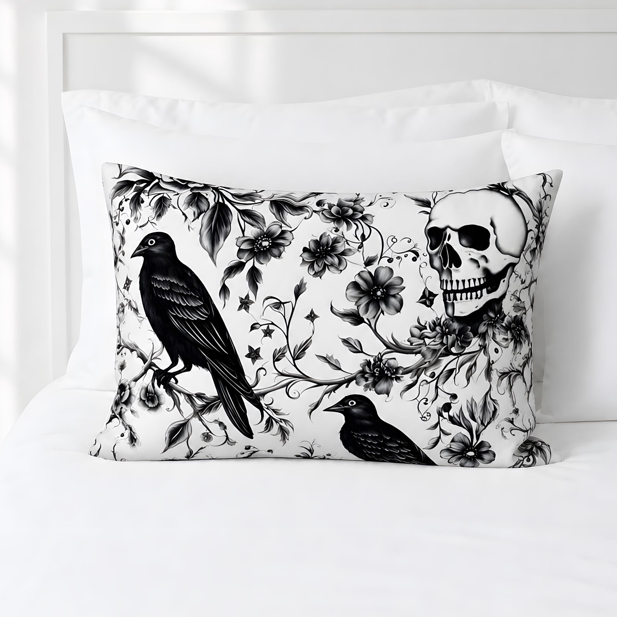 Black raven skull pillow sham with gothic floral artwork on white cotton bedding.
