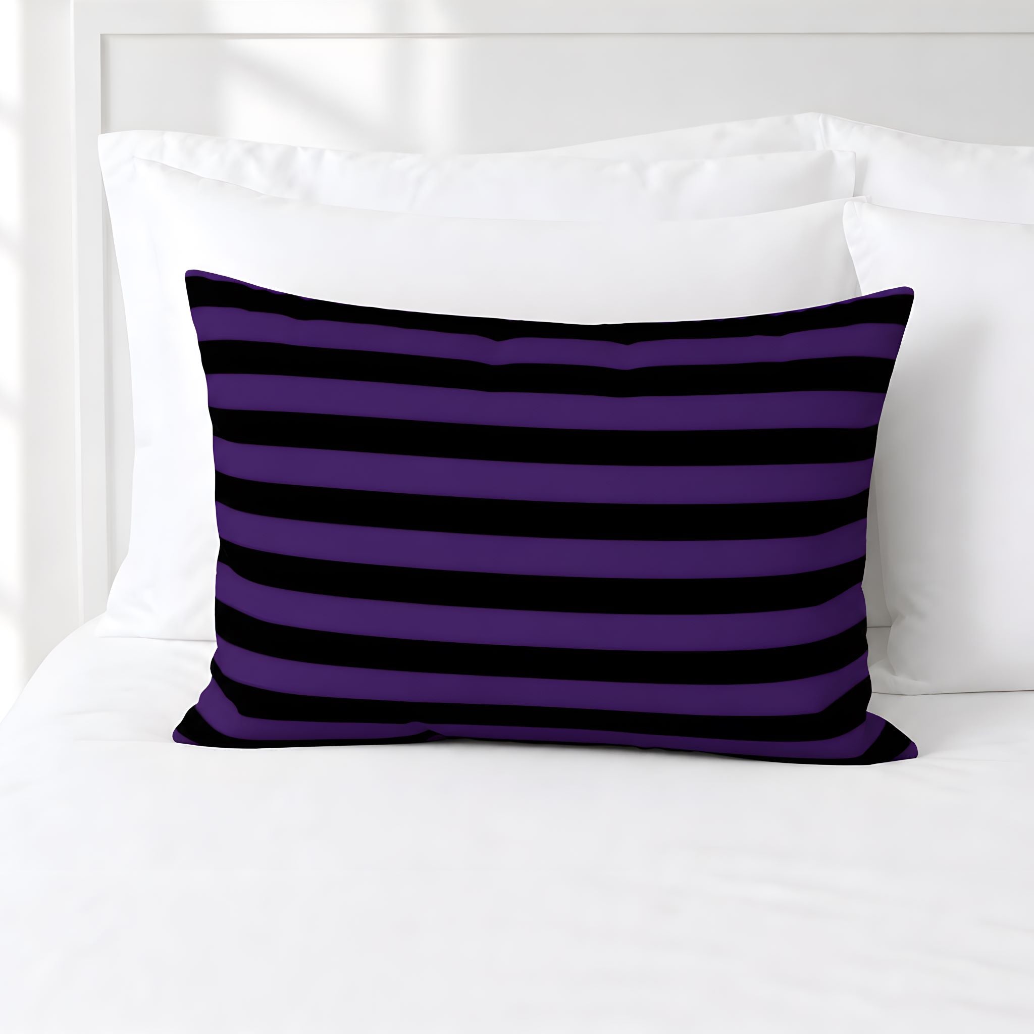 Halloween black and purple sham on white bedding.