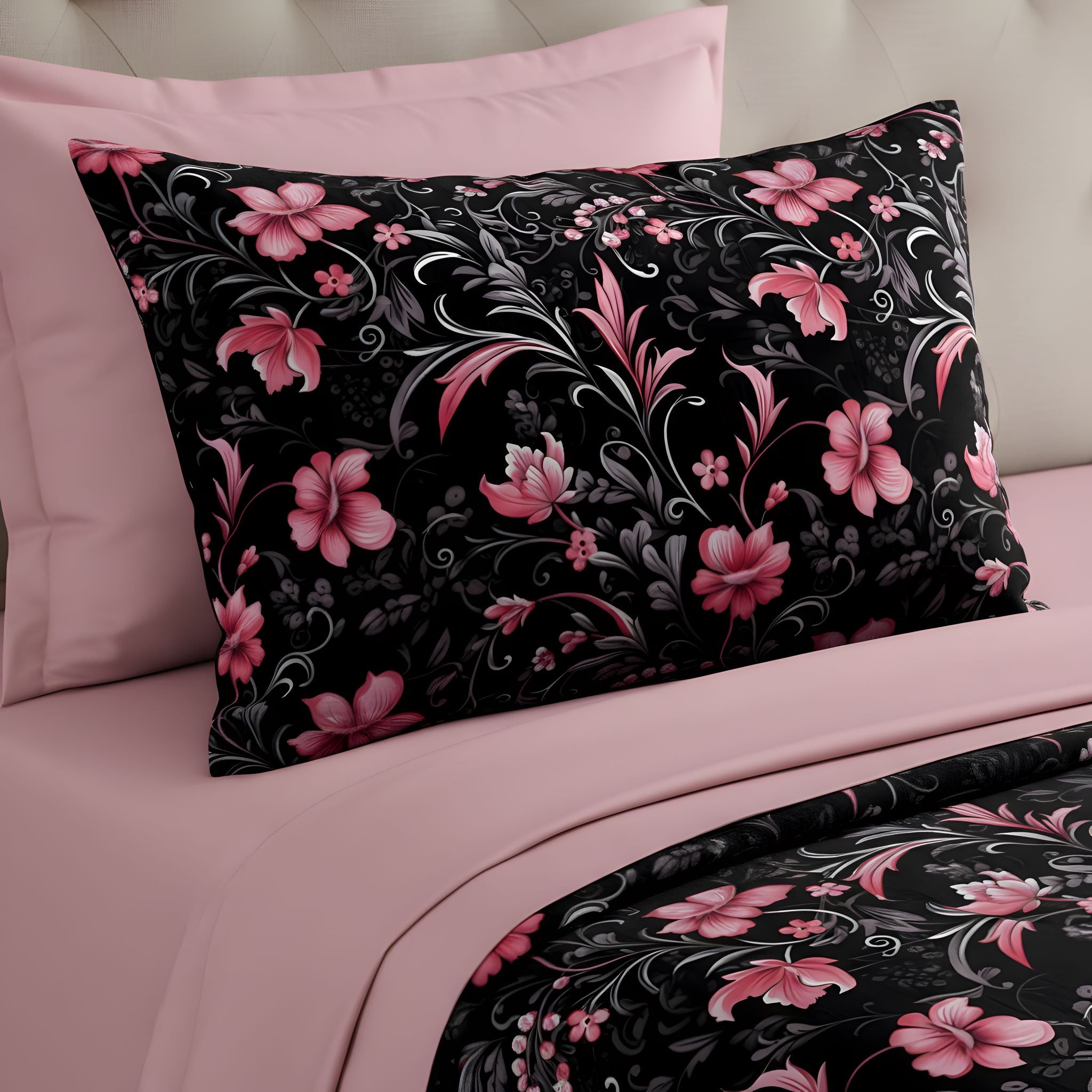 Black pillow sham with pink floral pattern on a pink bed for a spring aesthetic look.