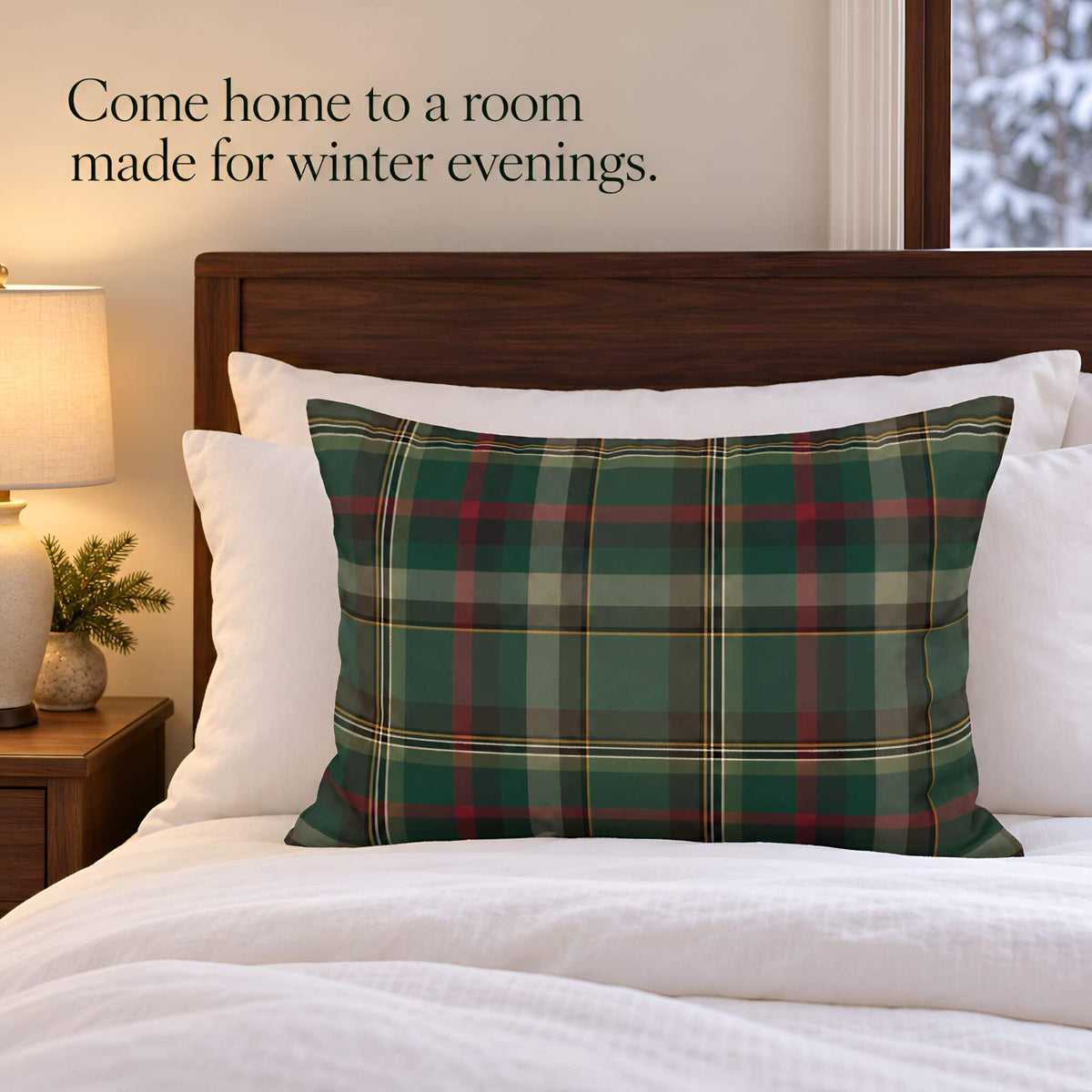 Cedar Ember plaid pillow sham styled on a bed with white linens and a dark wood headboard.