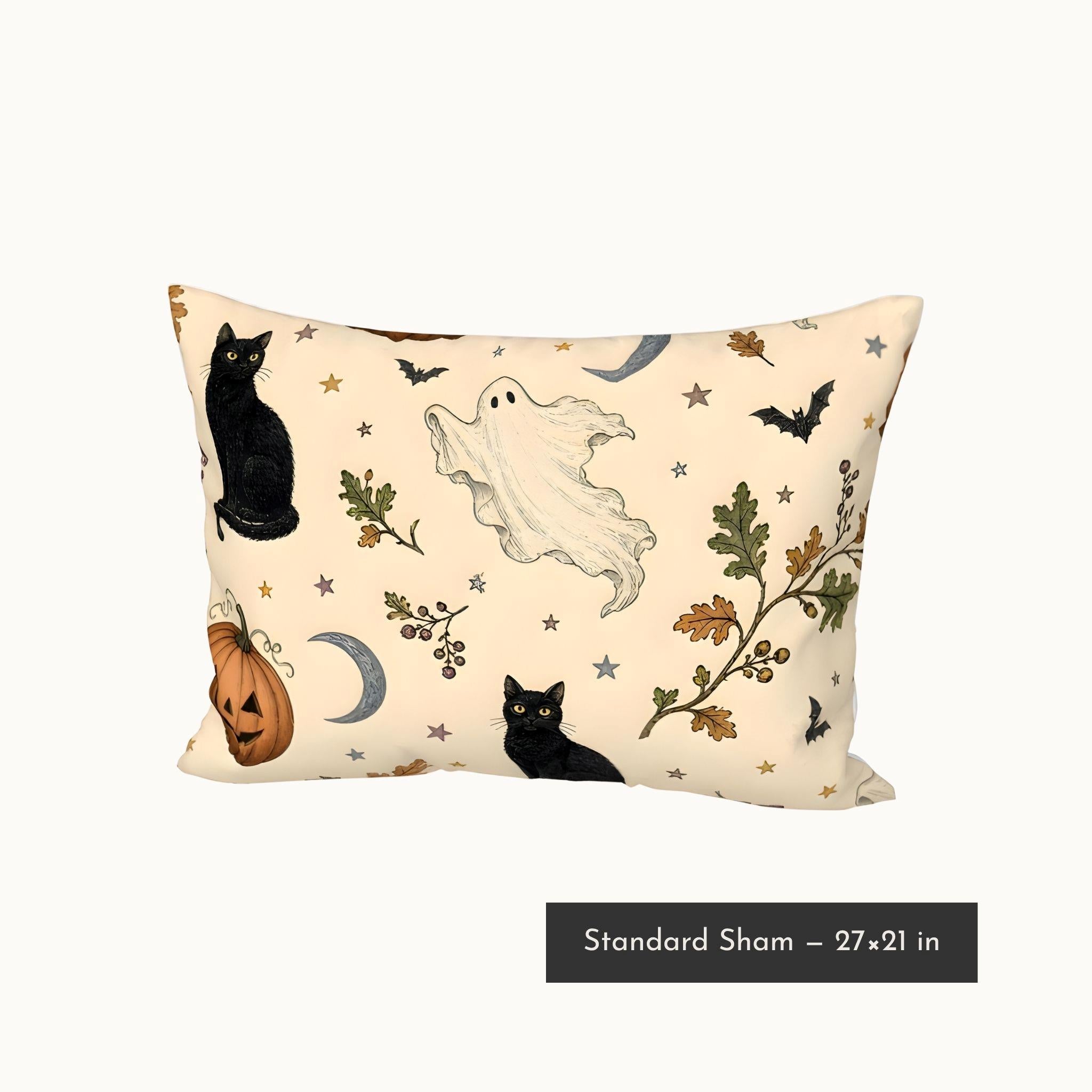 A pillow sham for twin xl and queen bedding, with a Halloween cream print featuring black cats, a white ghost, a jack-o'-lantern, bats, stars, and autumn leaves. A black text label at the bottom reads 'Standard Sham - 27"x21"'.