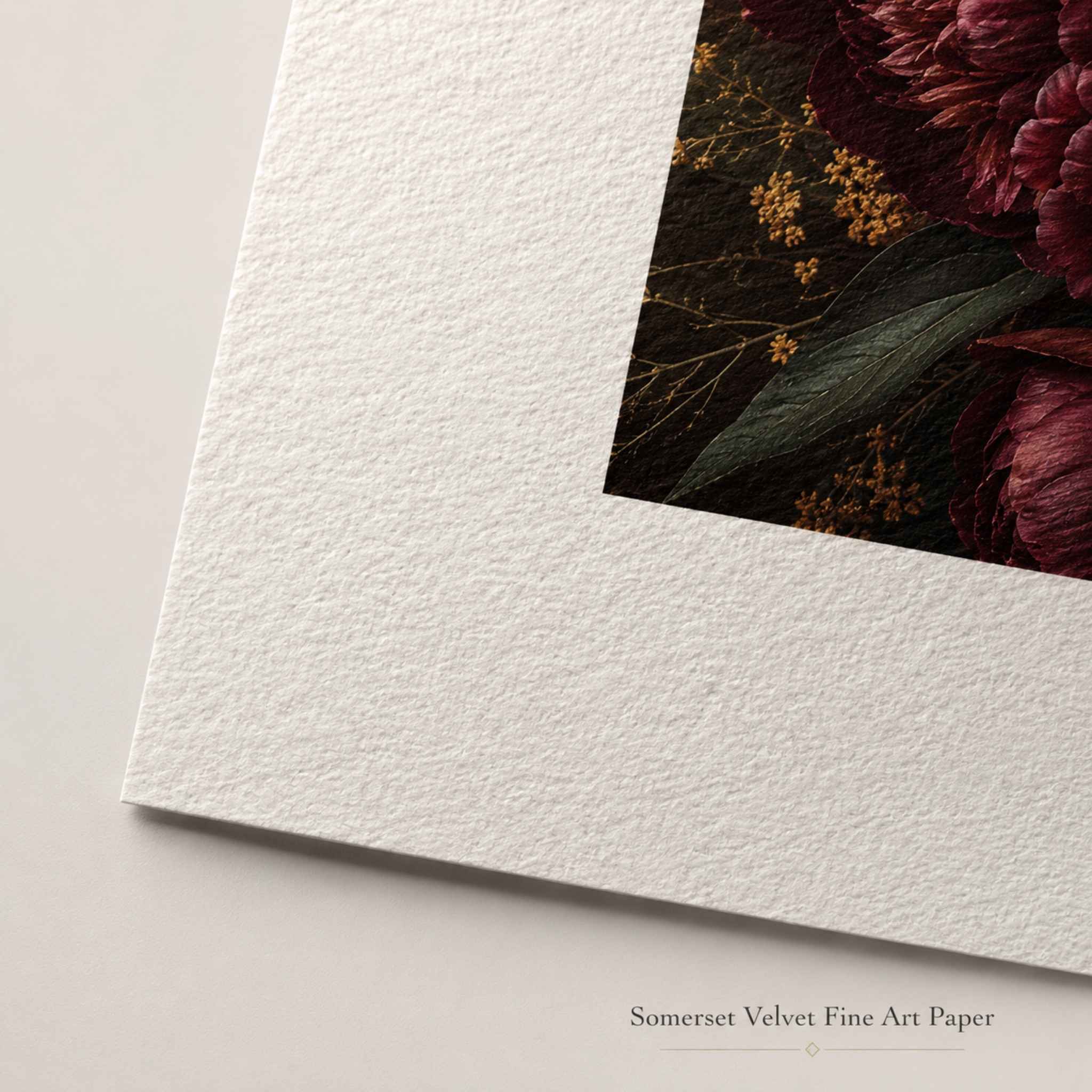Somerset Velvet fine art paper close-up showing textured cotton paper with dark floral artwork.