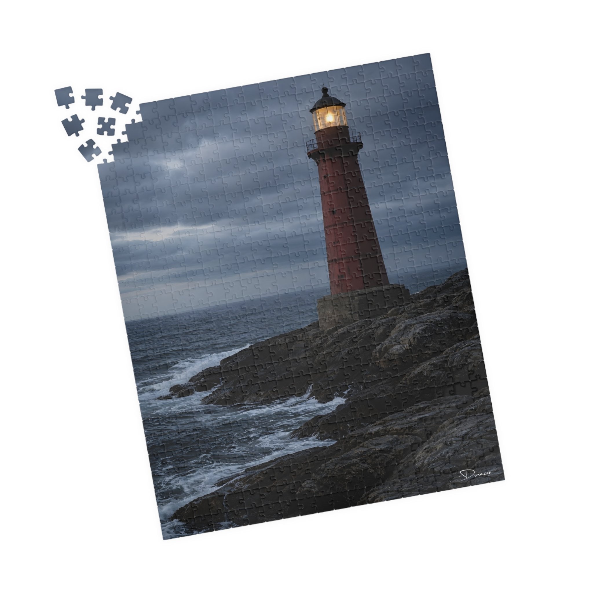 A 500 piece Jigsaw puzzle with a lighthouse on a cliff and ocean background