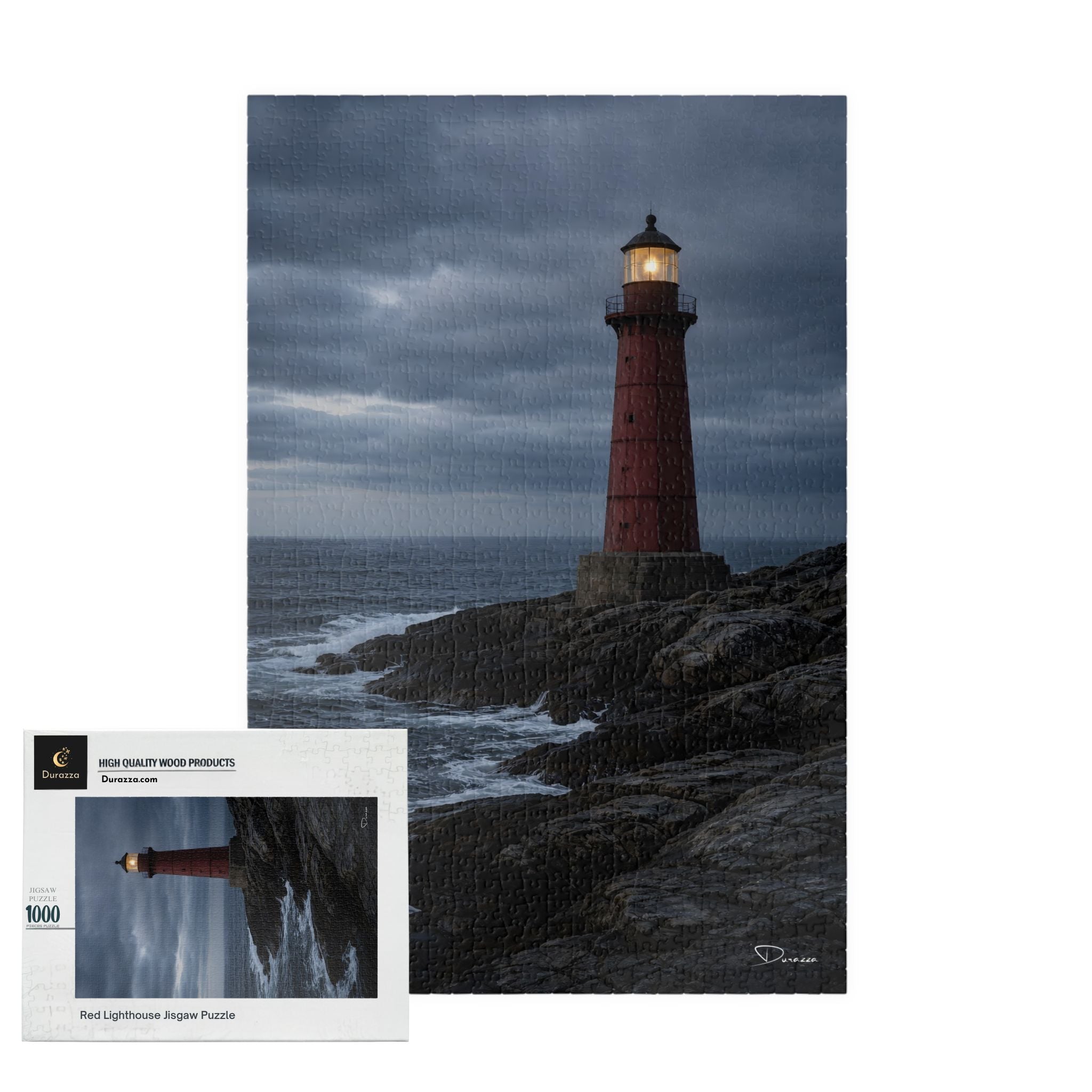 A Durazza Jigsaw puzzle with a Lighthouse on a rocky outcrop with a stormy sky, accompanied by a puzzle box.