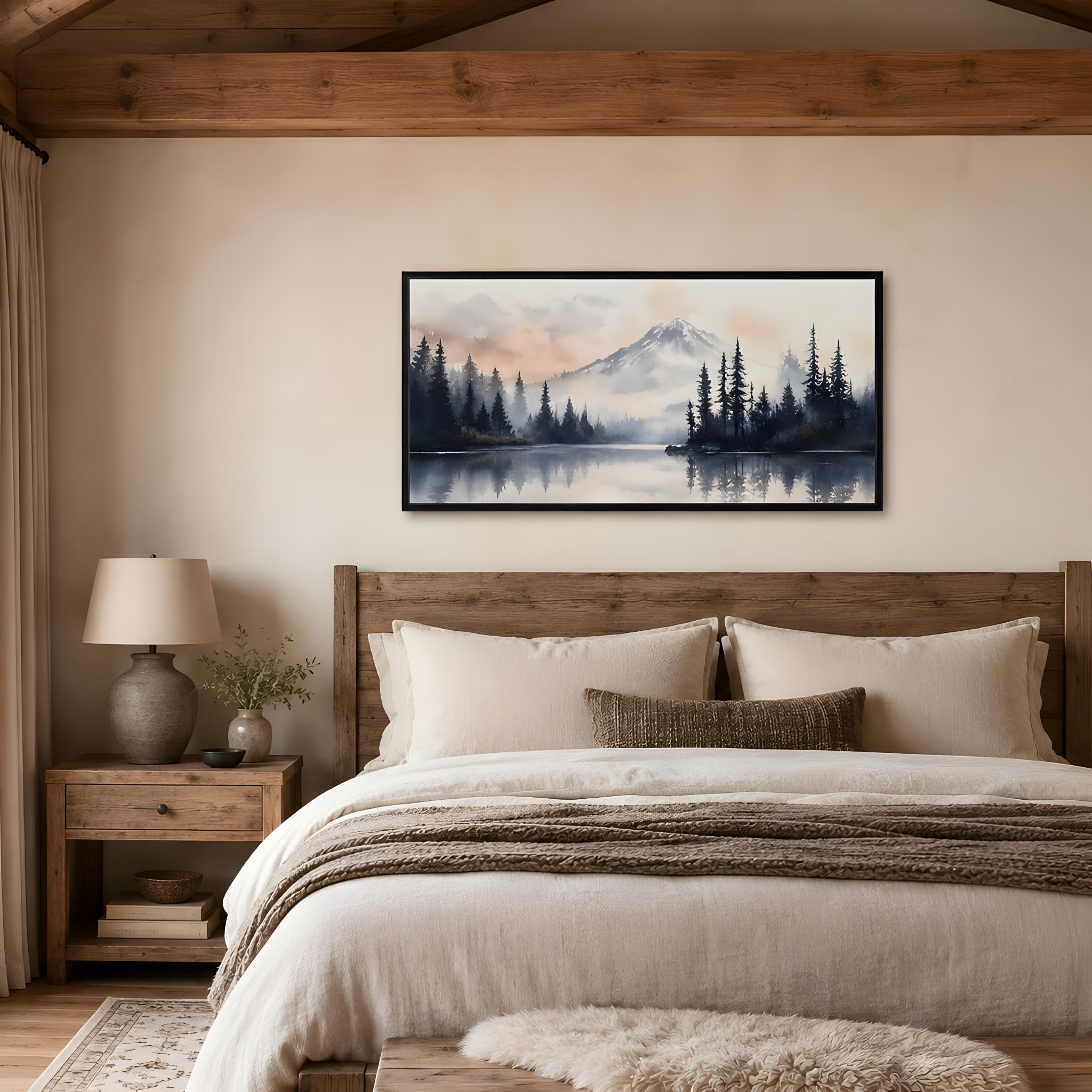 Rustic mountain landscape art on on a framed stretched canvas hanging above a bed.