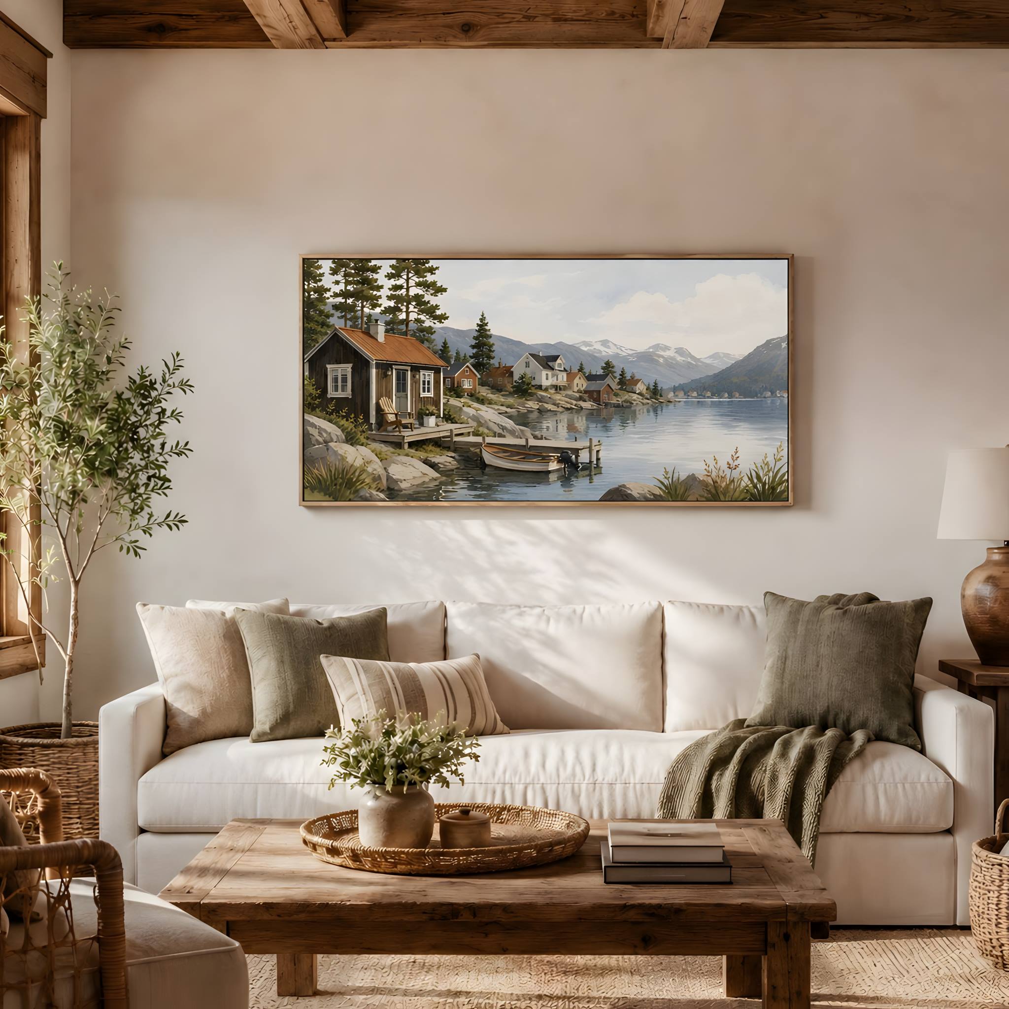 Mountain fjord wall art over beige sofa with pillows and greenery in a rustic living room.