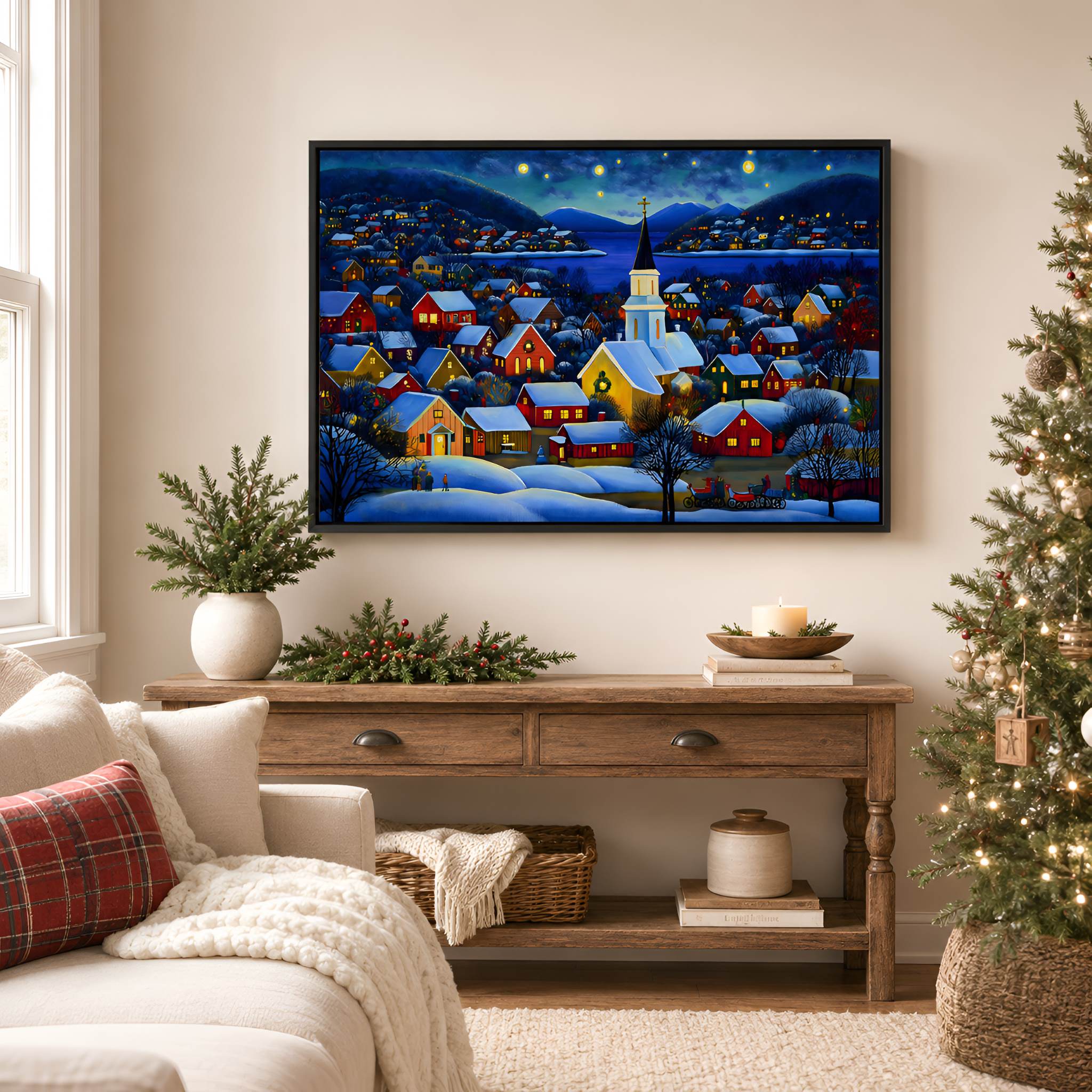 Living room with Christmas decorations, including a tree and a black framed painting of a snowy village on the wall.