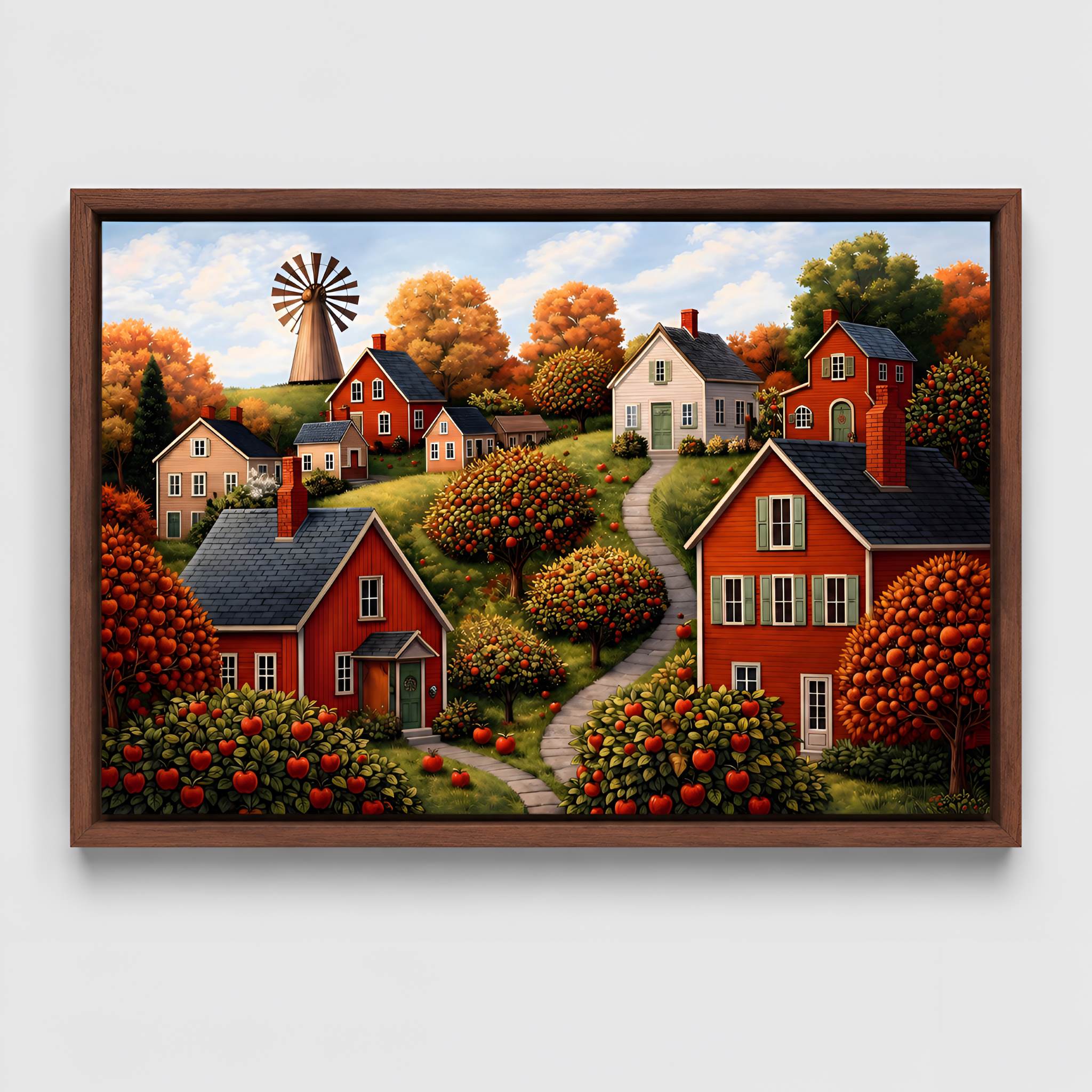 Walnut framed canvas wall art of an Autumn village scene with houses, trees, and a windmill.