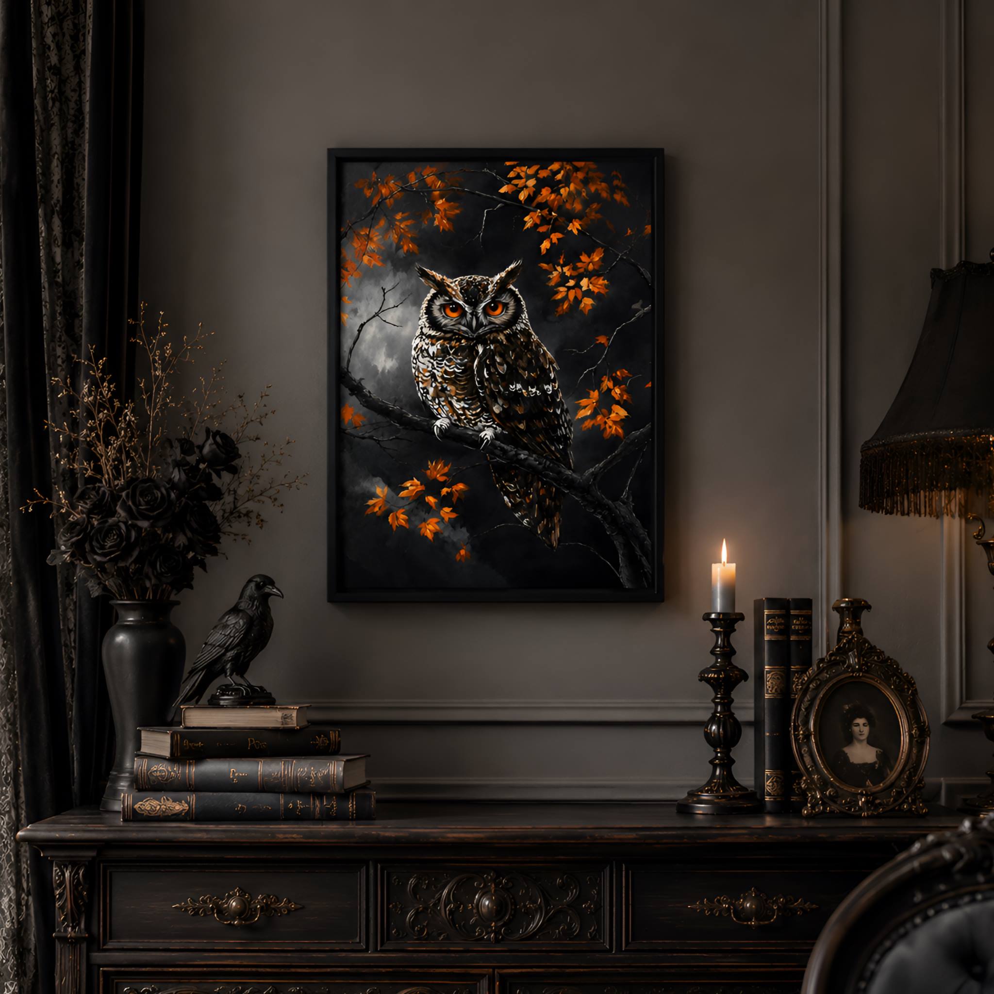 Moody room with a black owl painting on a wall, books, and a candle.