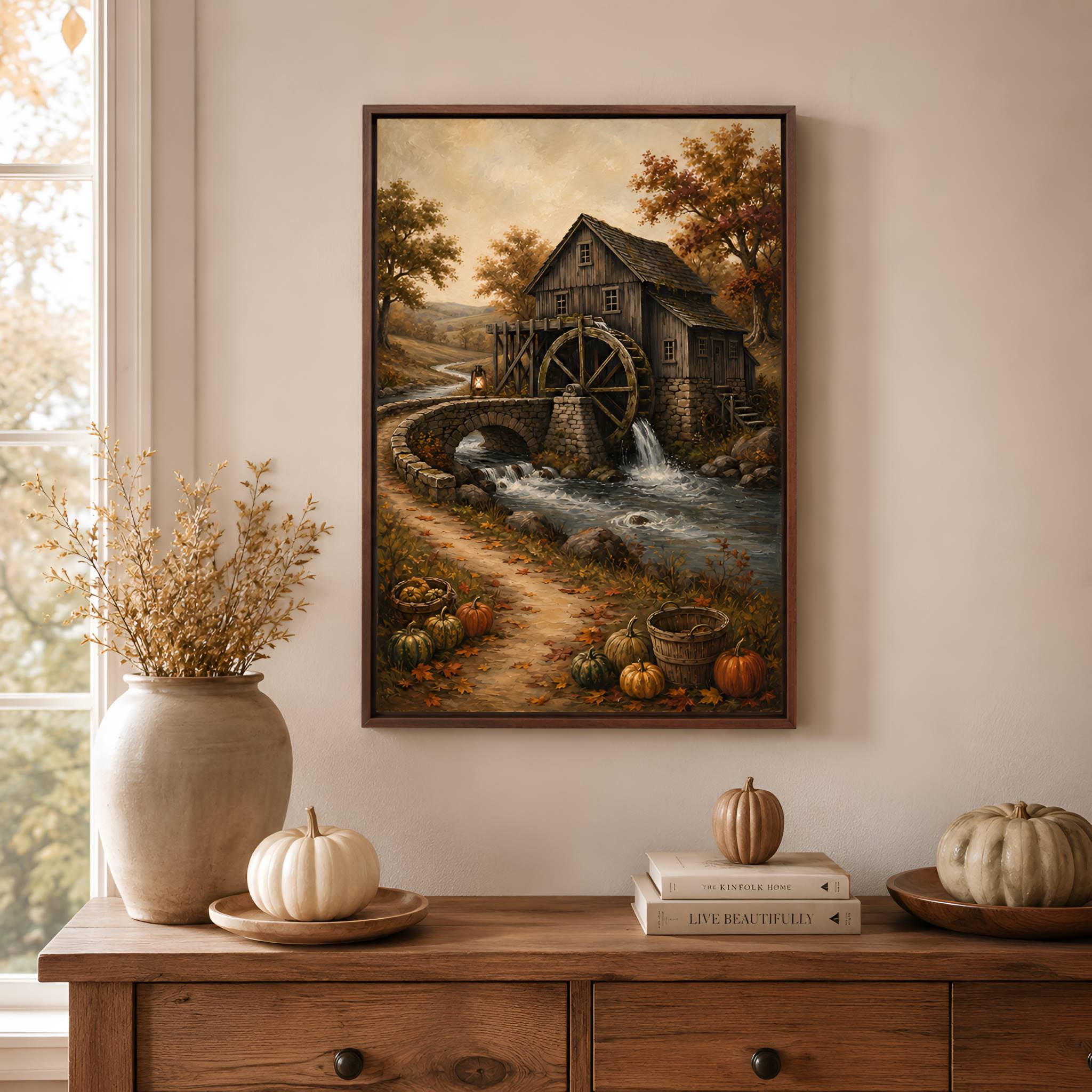 Autumn framed canvas wall art of a watermill with pumpkins on a wooden dresser.