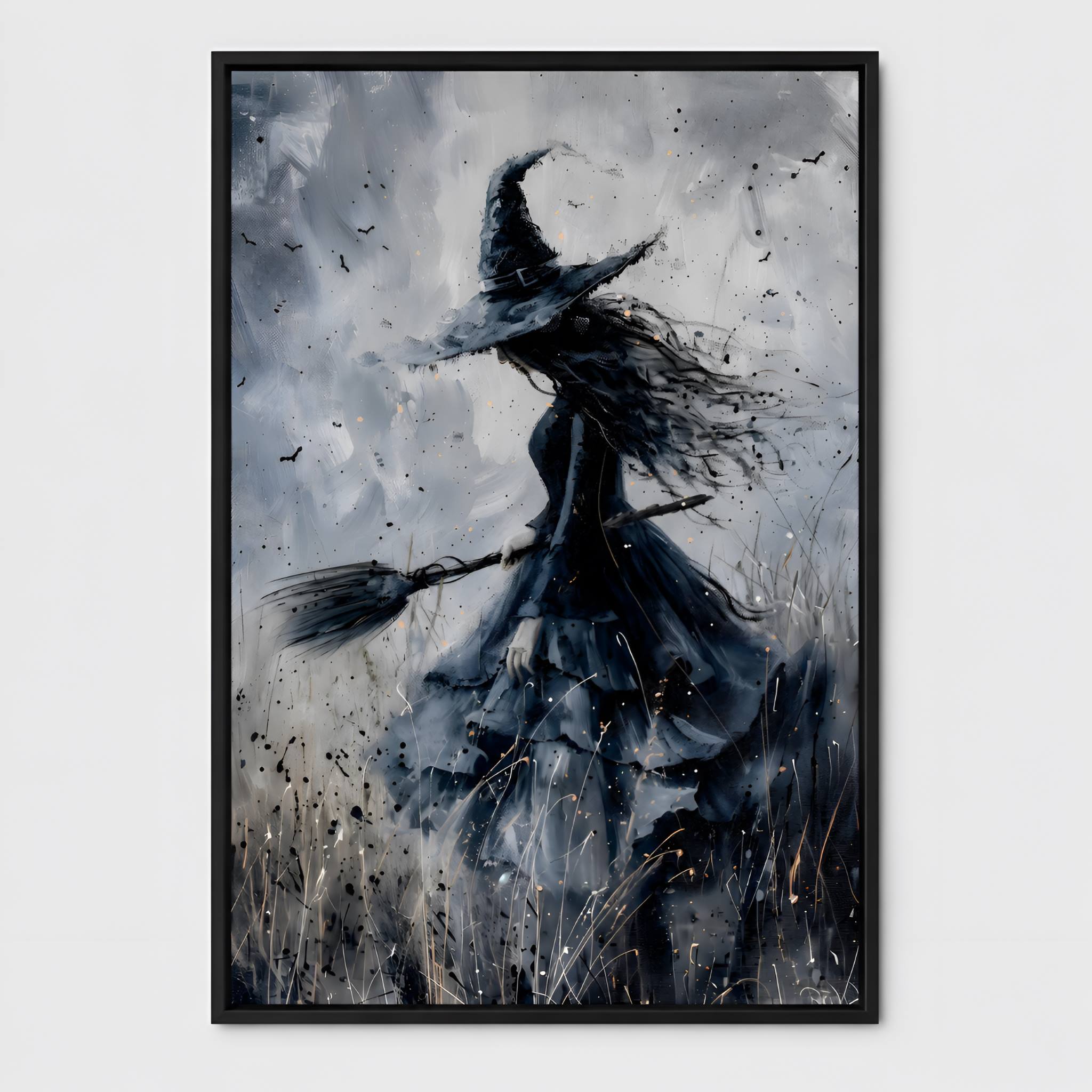 Black framed abstract artwork of a witch on a broomstick against a cloudy sky.