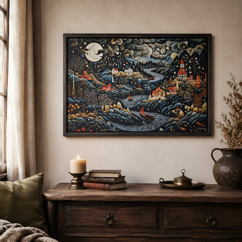 Wall art collection with framed folk landscape artwork above an antique wood dresser, candlelight, books, and cozy decor.