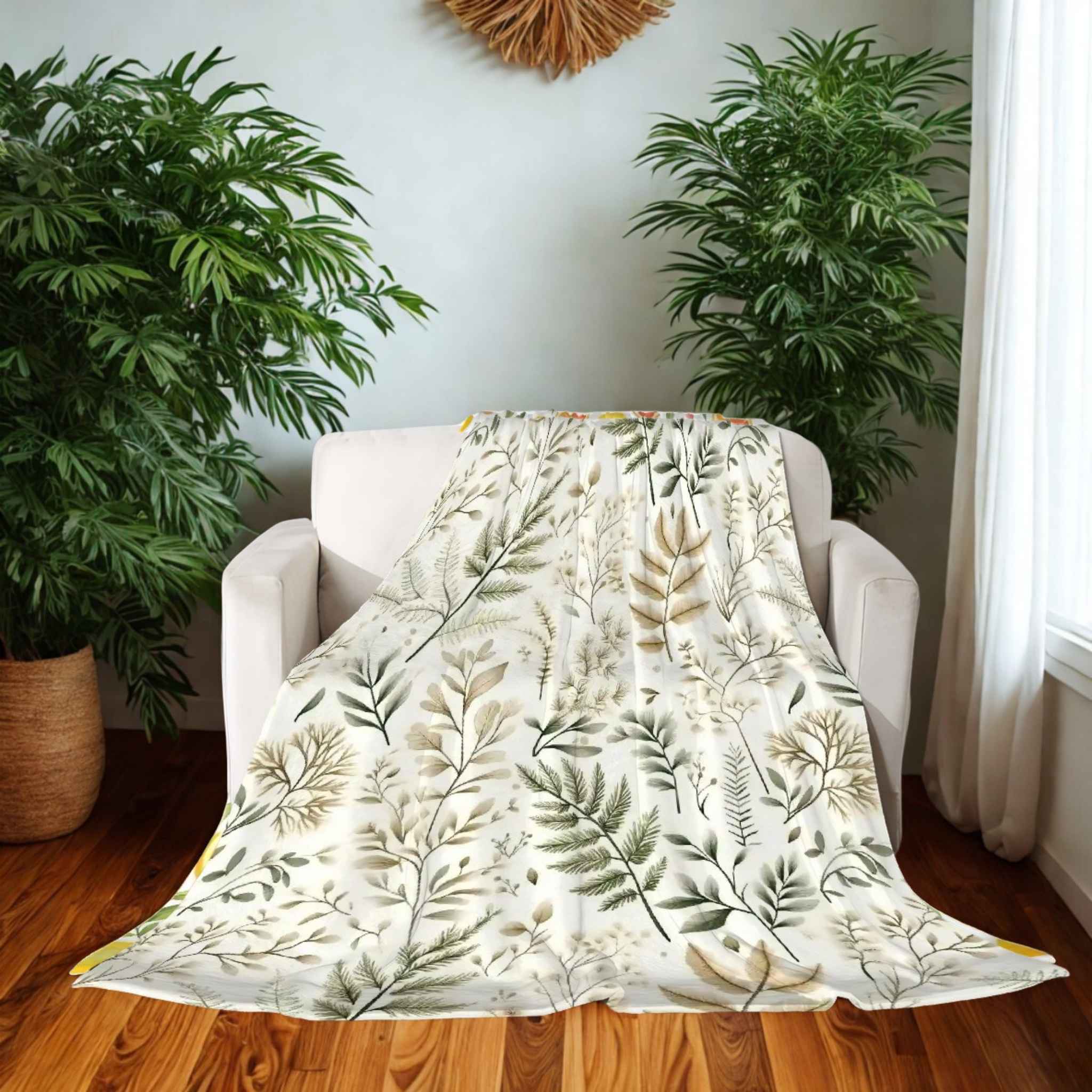 Floral-patterned blanket draped over a white armchair in a room with plants and wooden flooring.