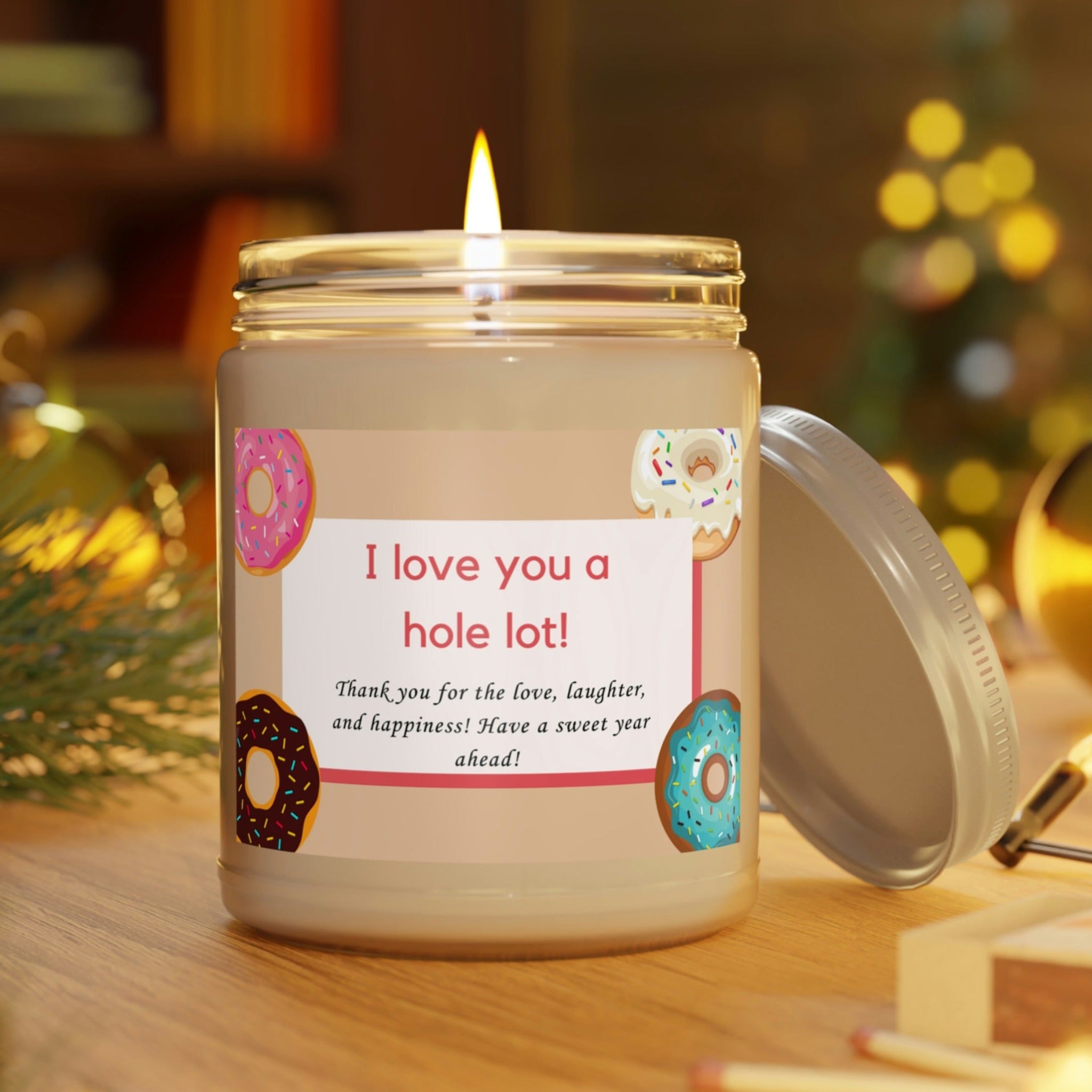 Donut Love Aromatherapy Scented Candle 9 oz sitting on table