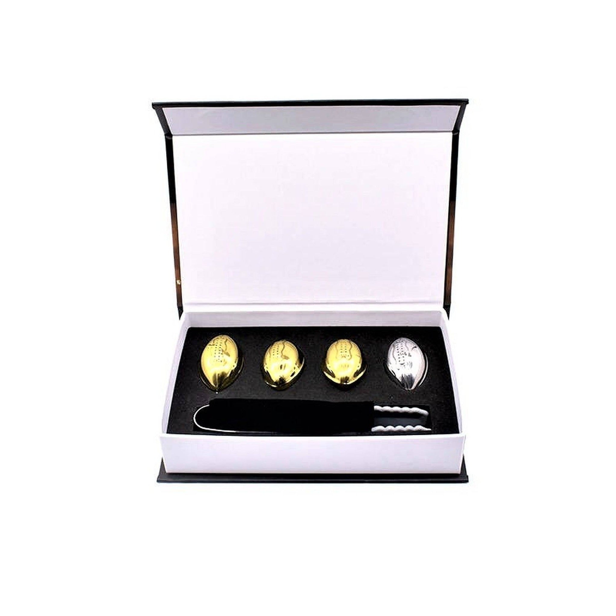 Football Whiskey Stones open box. 4 stainless steel footballs